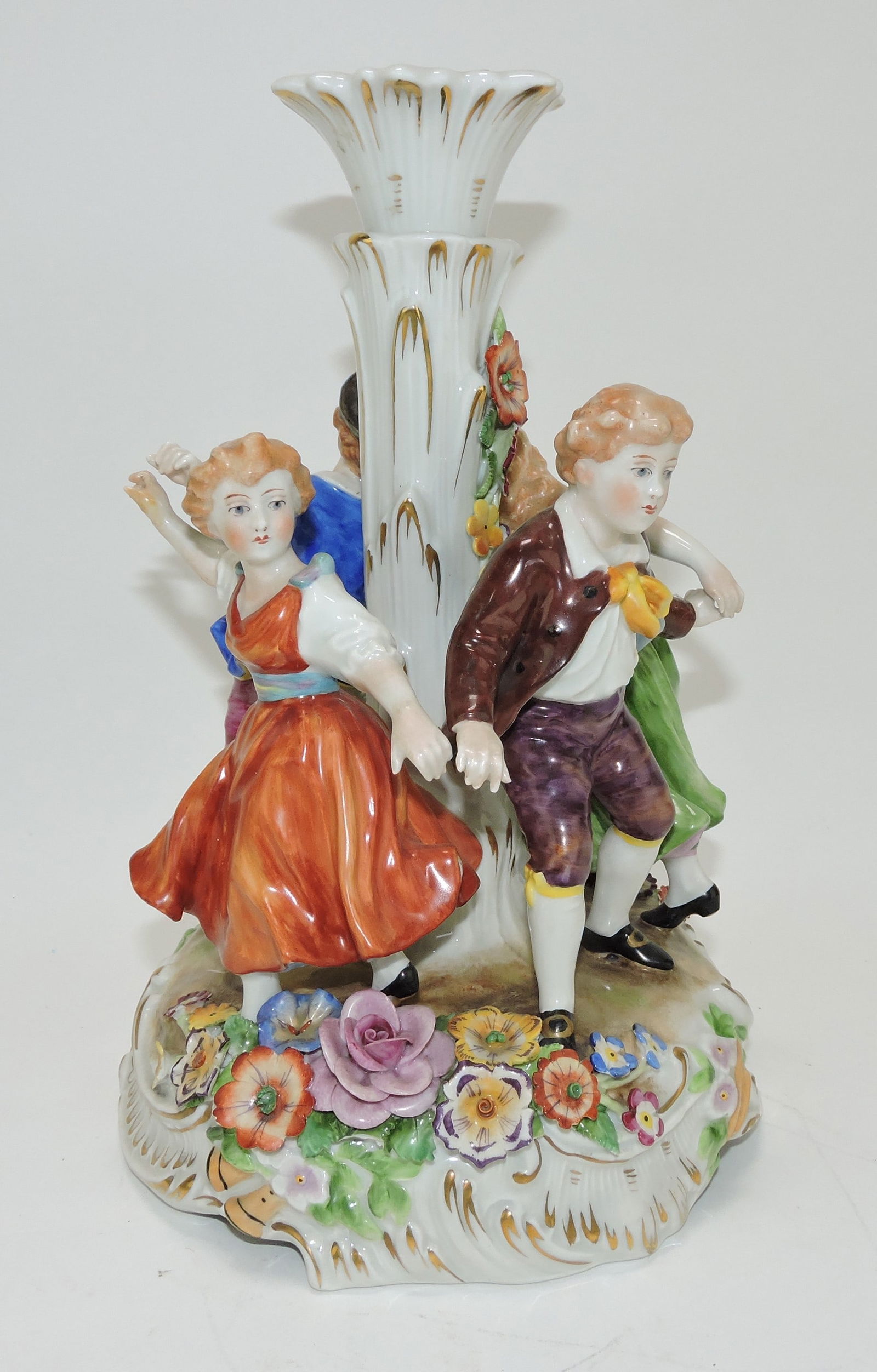 Porcelain ring around the rosie figural: candle holder, 11"