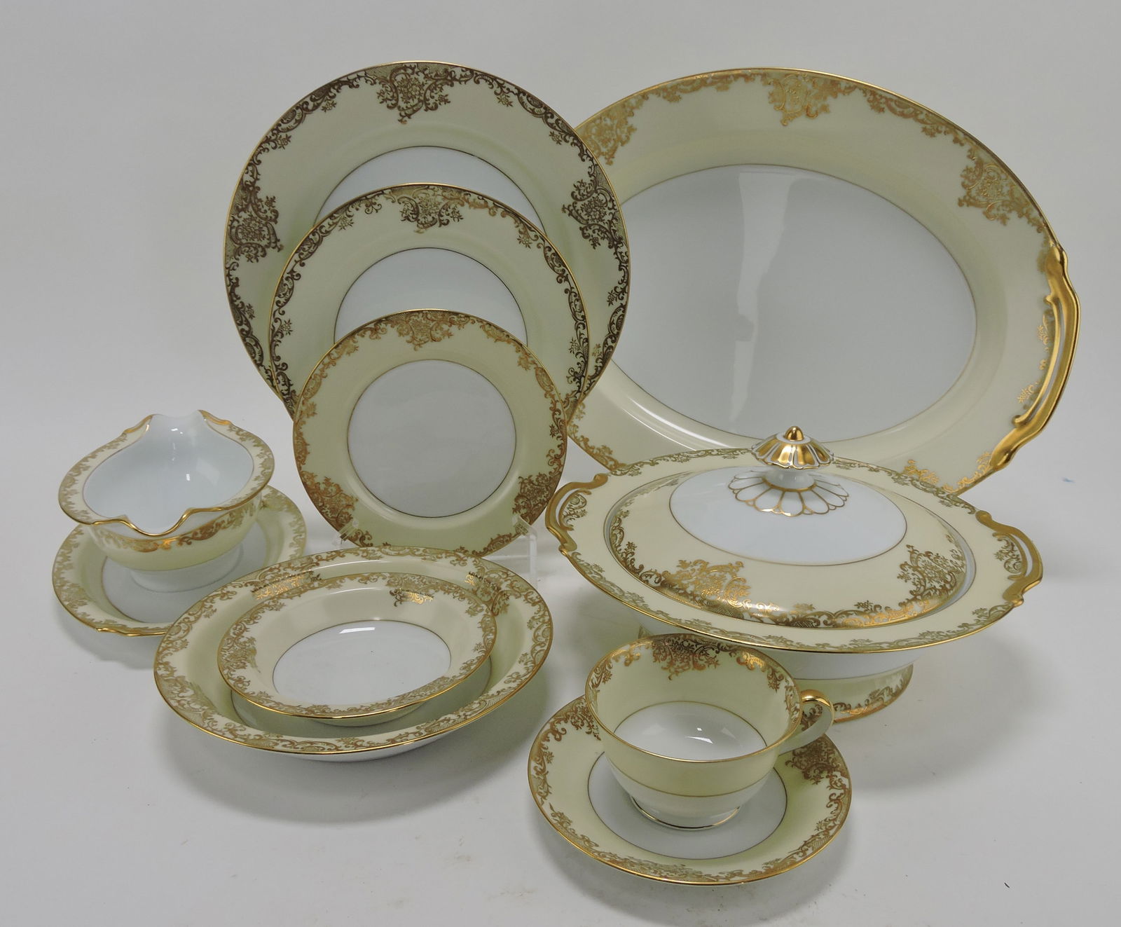 Noritake Glovern set of china:: 12 - 10", 11 - 7 3/4" and 12 - 6 1/4" plates, cream, sugar, sauce boat, 10 1/2" oval bowl, 11 1/2" and 16" platters, 12 - 5 1/2" fruits, covered vegetable, 9 cups, 11 saucers, 12 - 7 3/4" rimmed soup