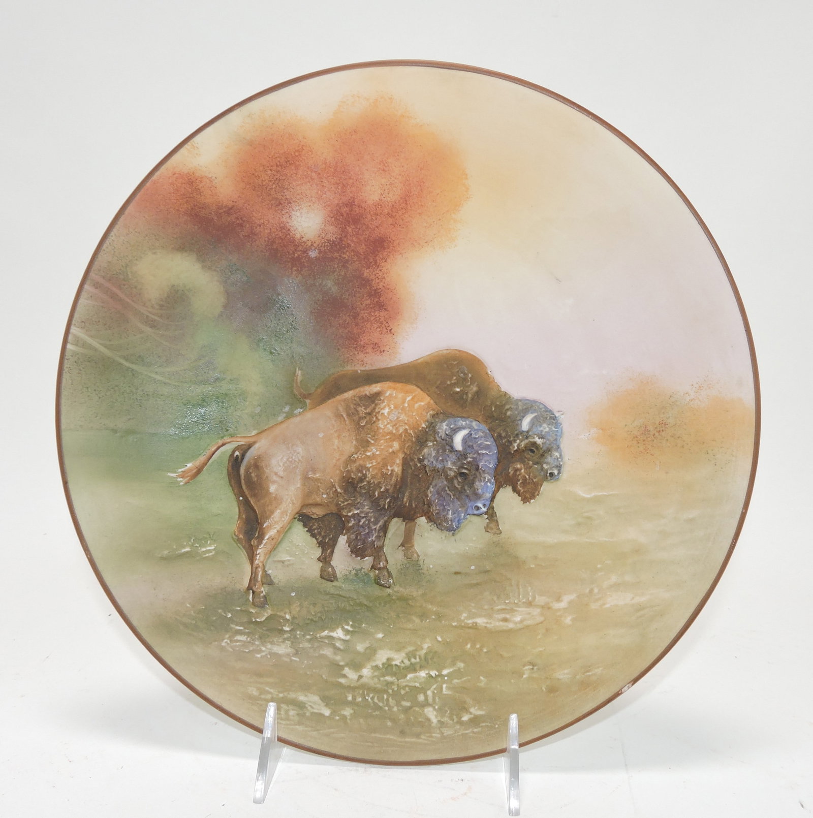 Nippon blown out buffalo plate 10 1/2",: rim flake