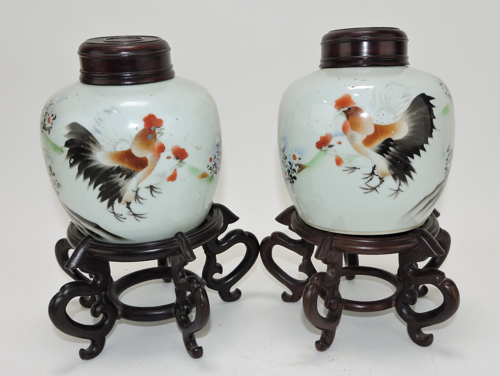 Oriental pair of early tea jars with: roosters on teak wood stands and teak wood lids, 9 1/2"