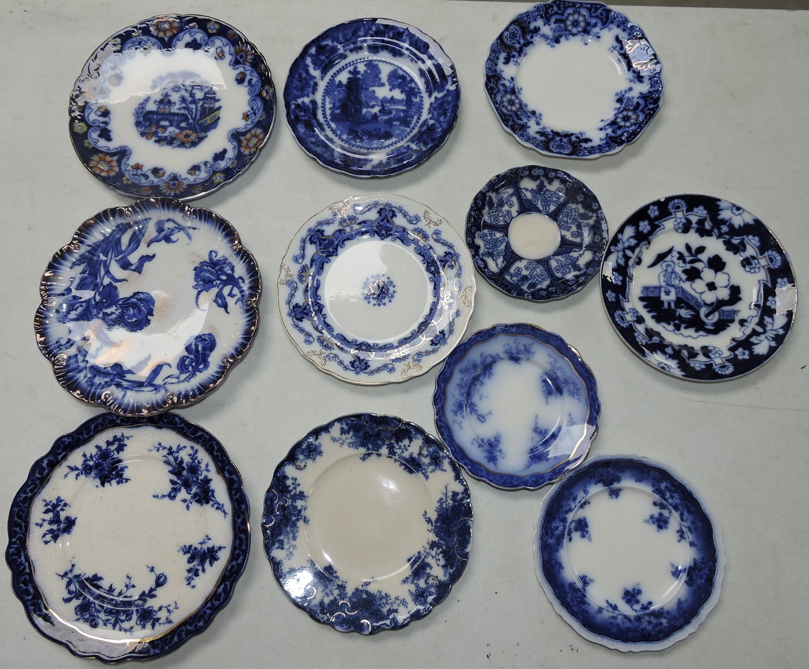 Flow blue lot of 11 plates, various: condition