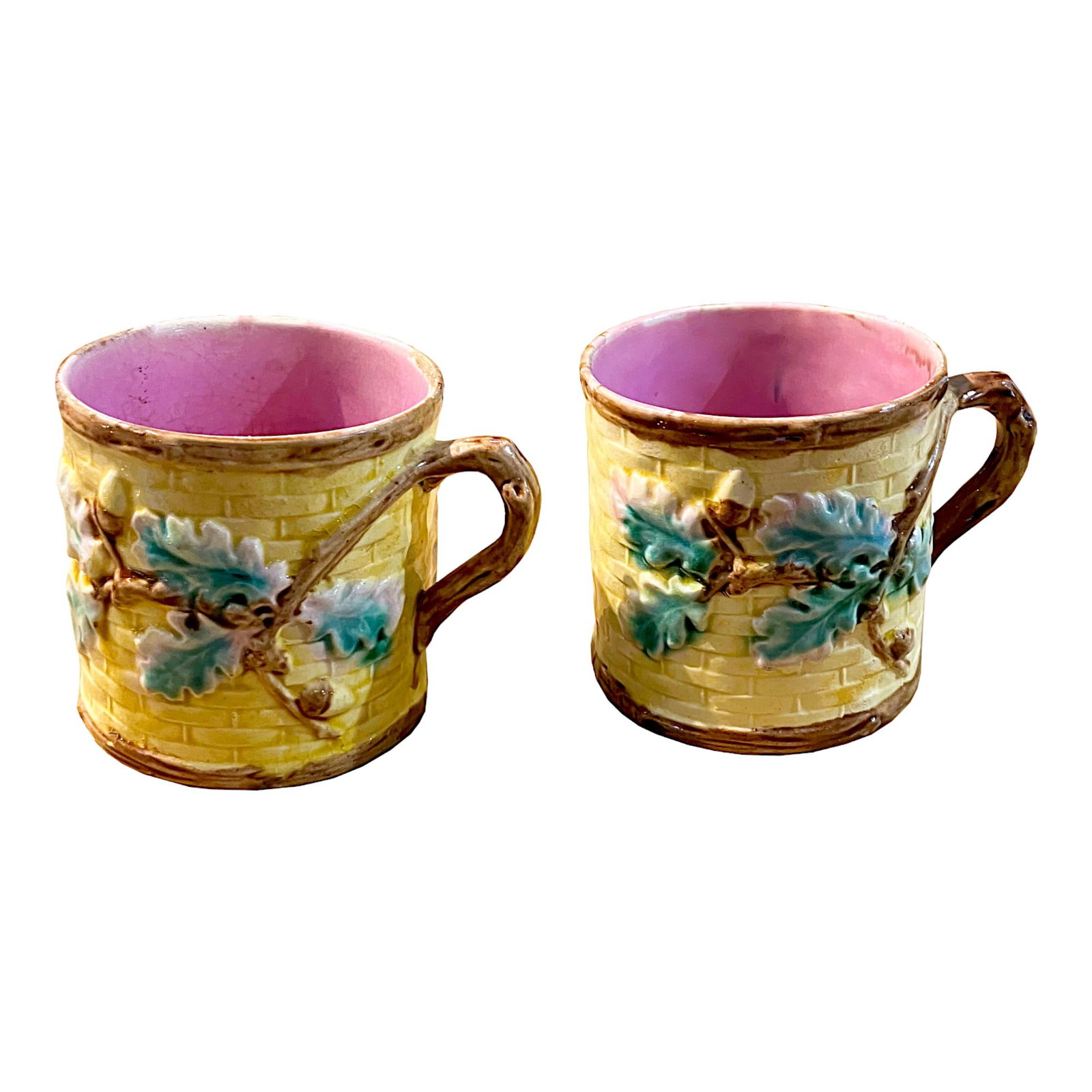 Two Griffin Smith and Hill Majolica: Oak Mugs c.1880. The basketweave bodies decorated with oak leaves and acorns with twig handles. Height; 4.5 inches Impressed Griffin Smith and Hill marks to base. Provenance: Nick Boston Antiques Lite