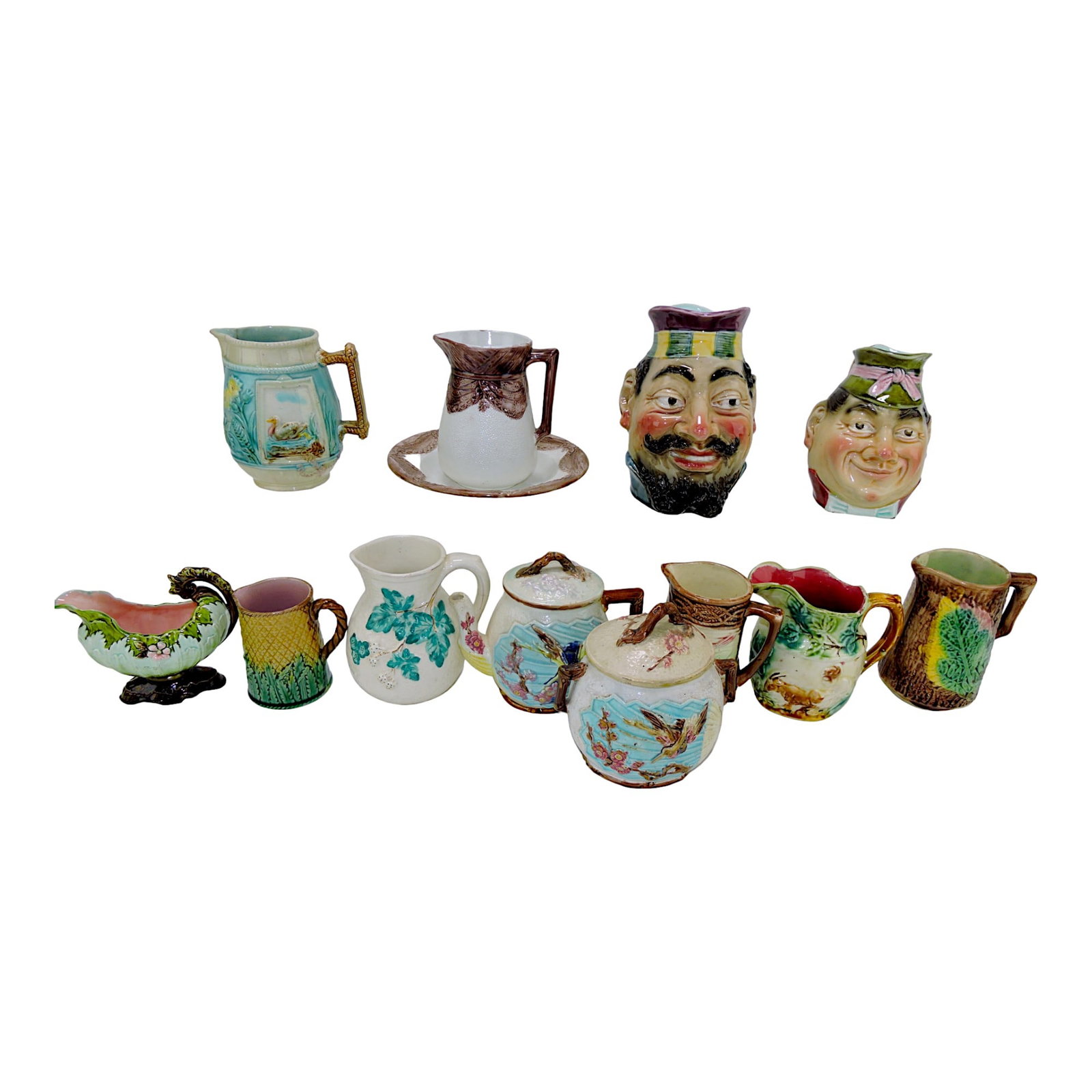 Majolica lot of 12 pitchers, sugar, and: teapot, various condition