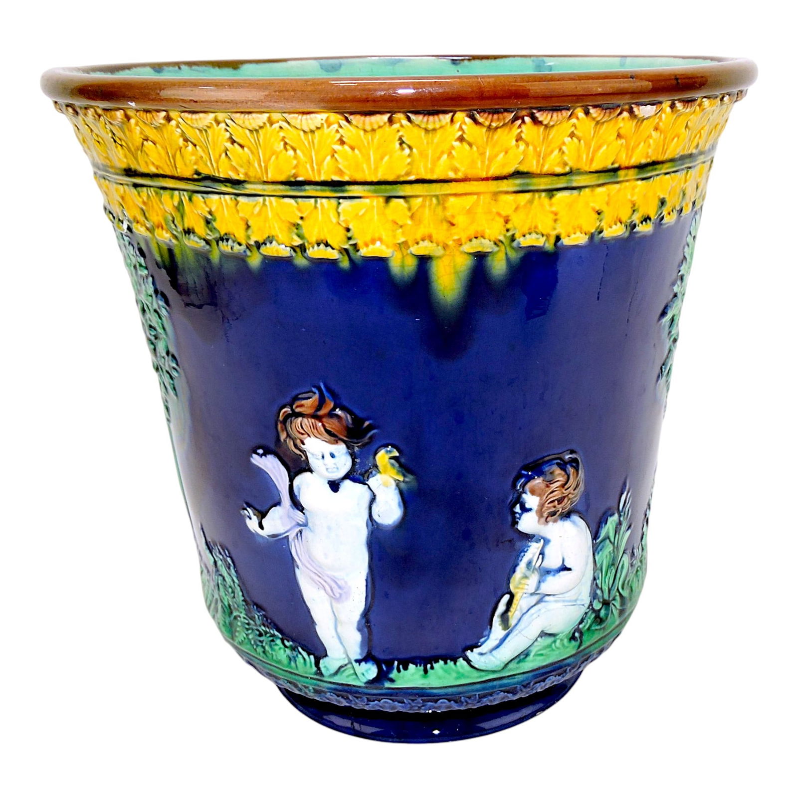 Majolica cobalt blue jardiniere with: children, 10"h, 10"w