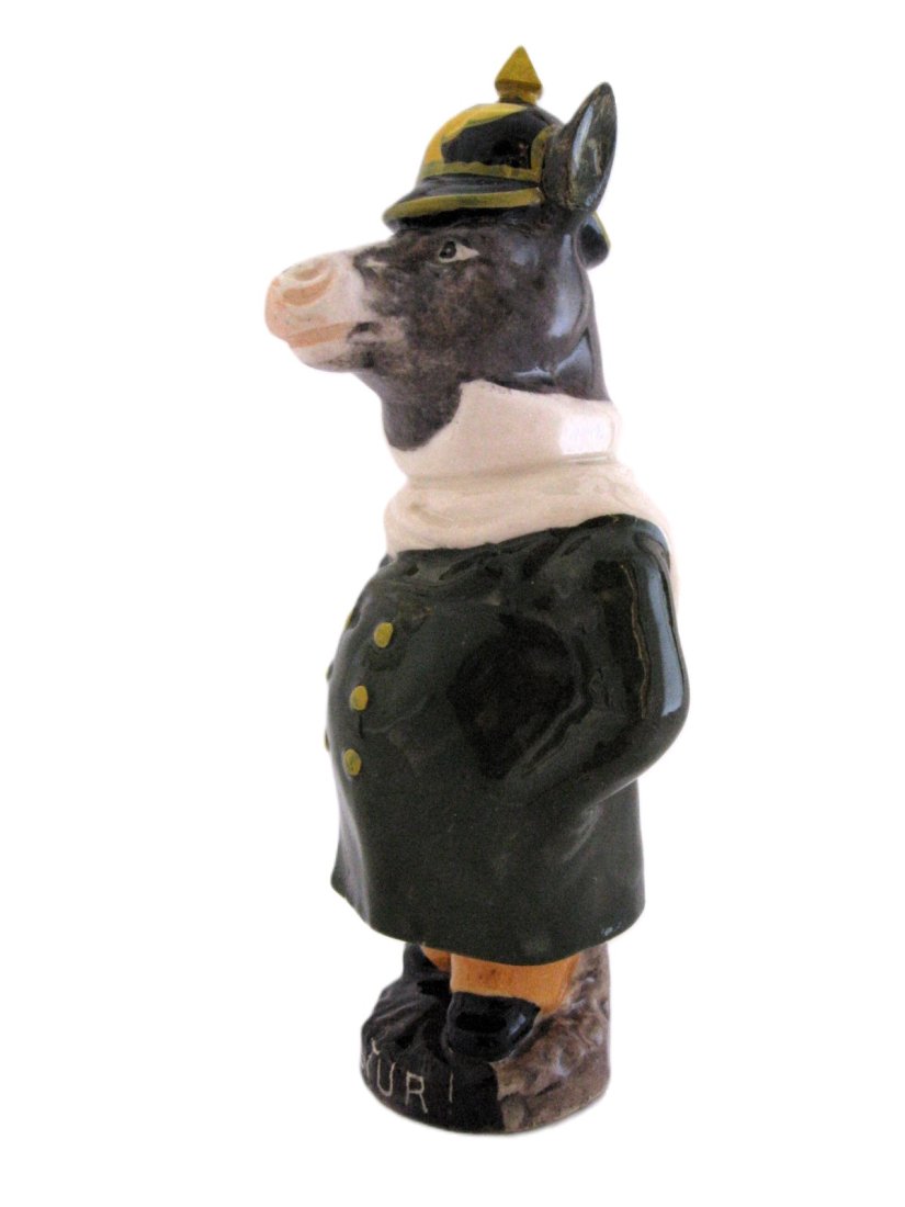 A very rare Saint Uze French majolica dressed donkey: with a helmet figural bank, circa 1900, 7"