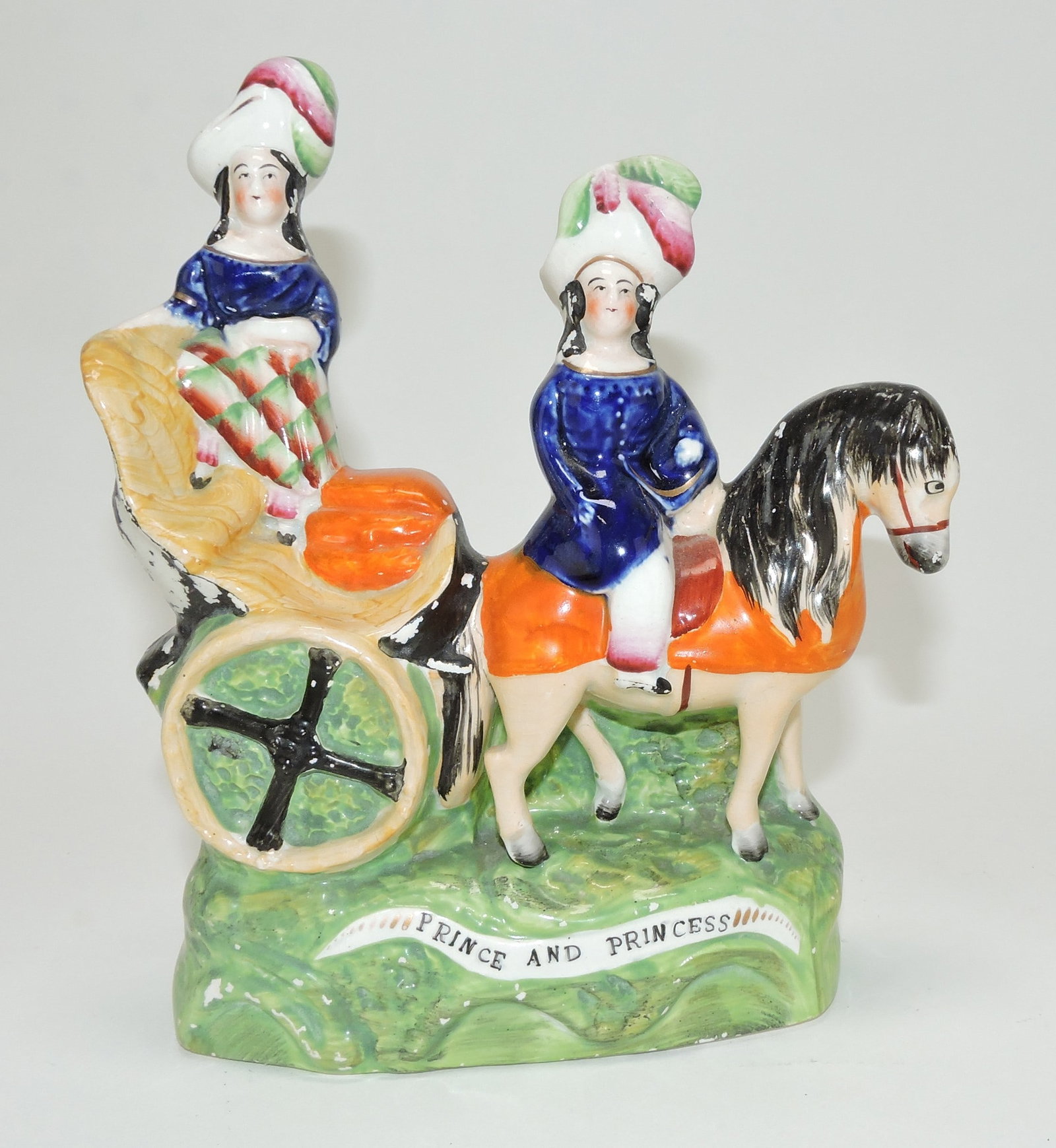 Staffordshire figure of prince and princess: in horsedrawn cart, 7 3/4"