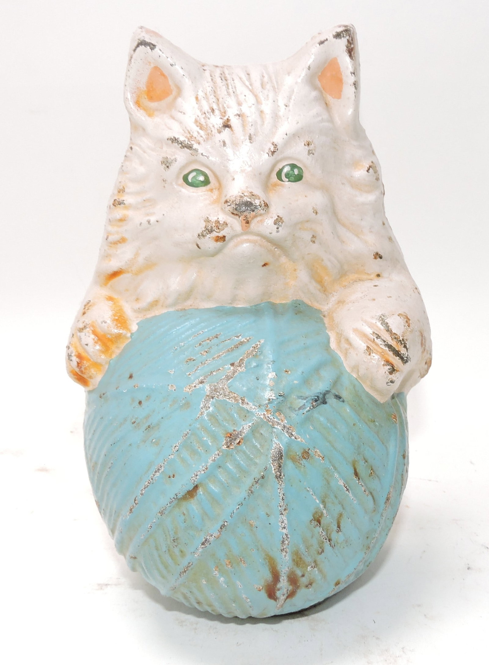 Cast iron cat with ball of yarn doorstop: .