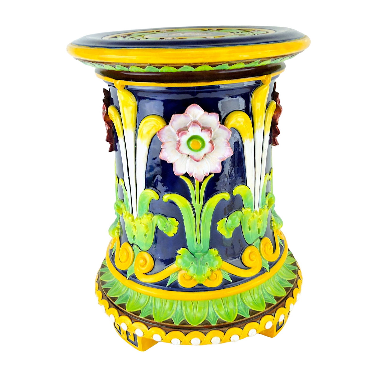 Minton Majolica Tudor Rose and: Prince of Wales Garden Seat c.1870, of waisted cylindrical form, molded in relief with alternating stylized Tudor Rose and Prince of Wales feathers, all above a scroll border, above stiff leaf tips an