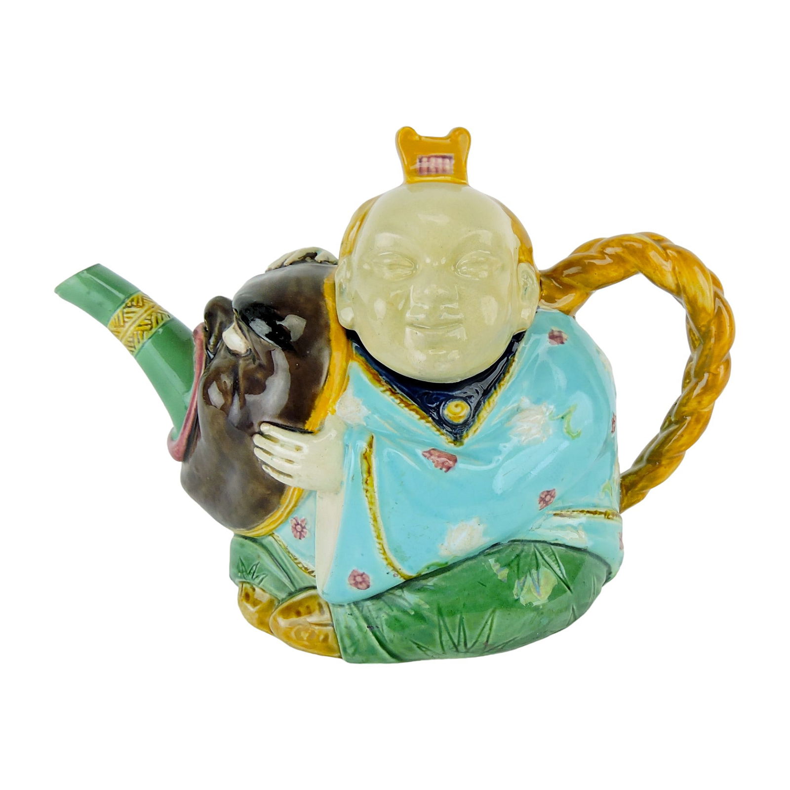 Minton Majolica Chinese Actor Teapot: c.1875, formed as boy in Chinese costume holding mask, the spout issuing from its mouth, his pigtail forming the handle, the head forming the cover, with a comb finial. 5 1/4"h, 7 1/2"l, professional