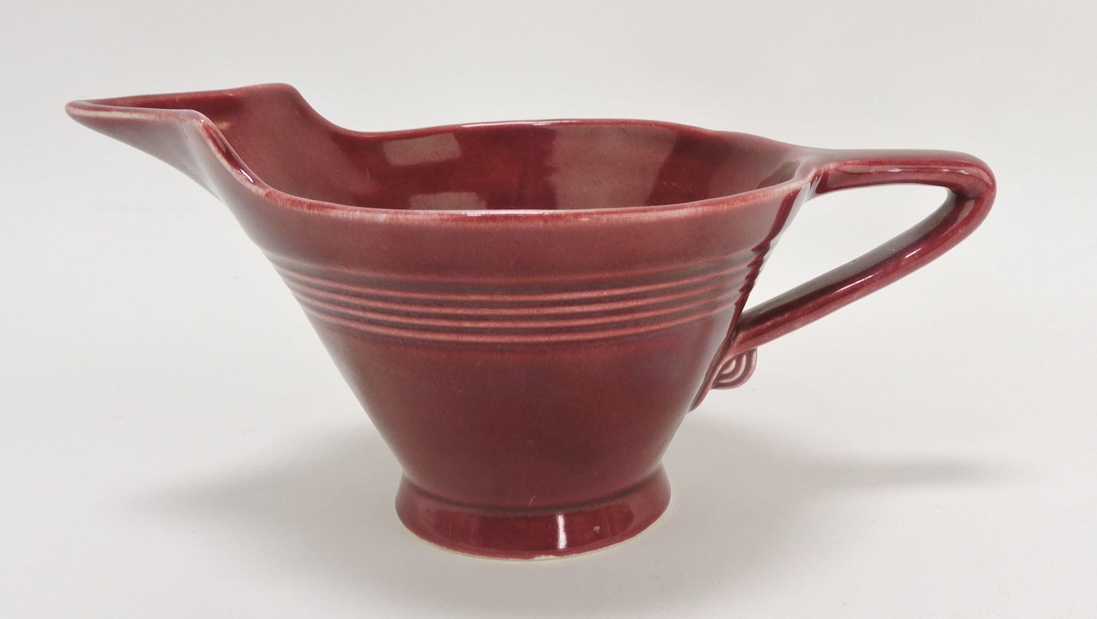 Harlequin high lip creamer with: short spout, maroon