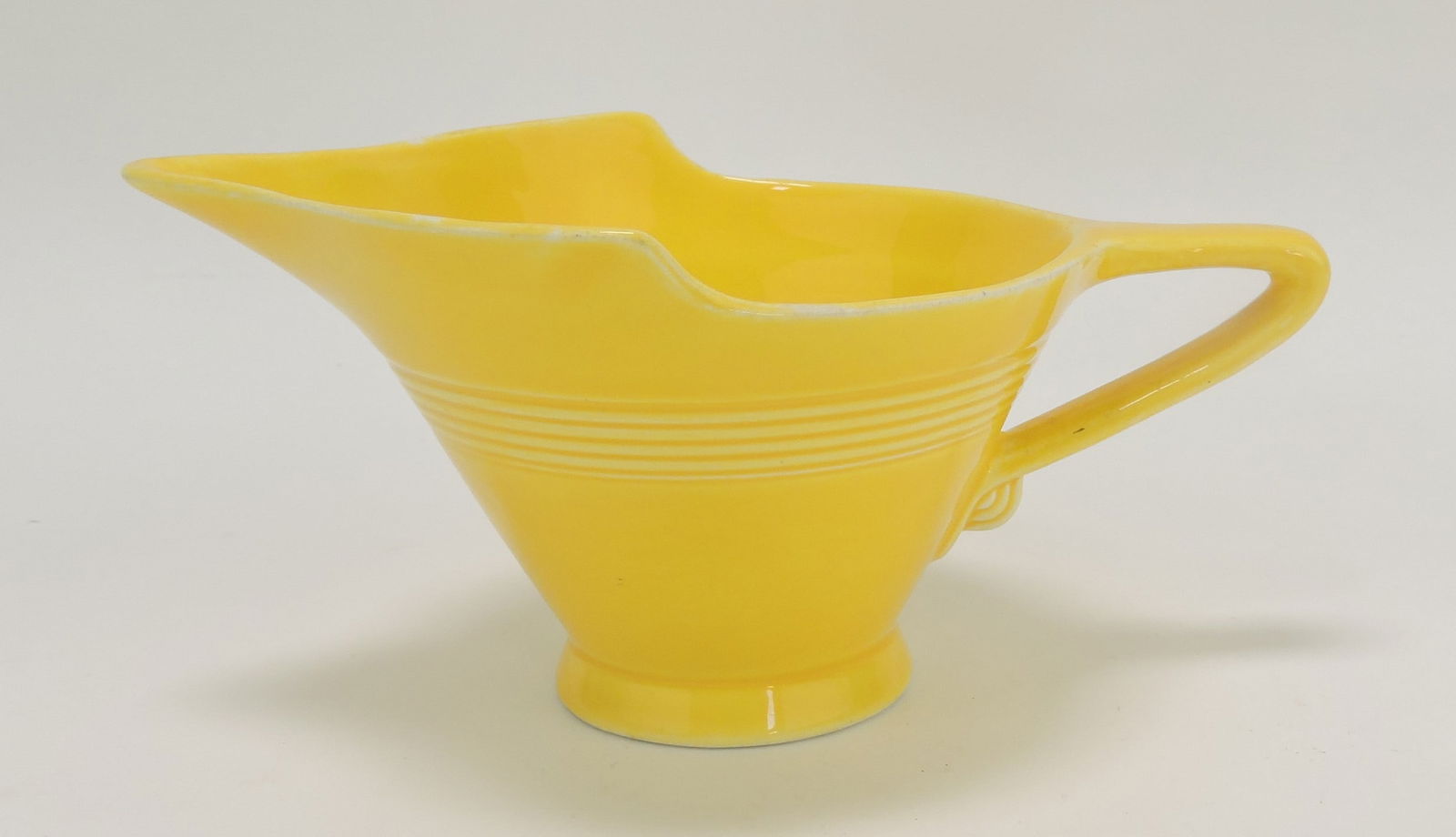 Harlequin high lip creamer with: long spout, yellow