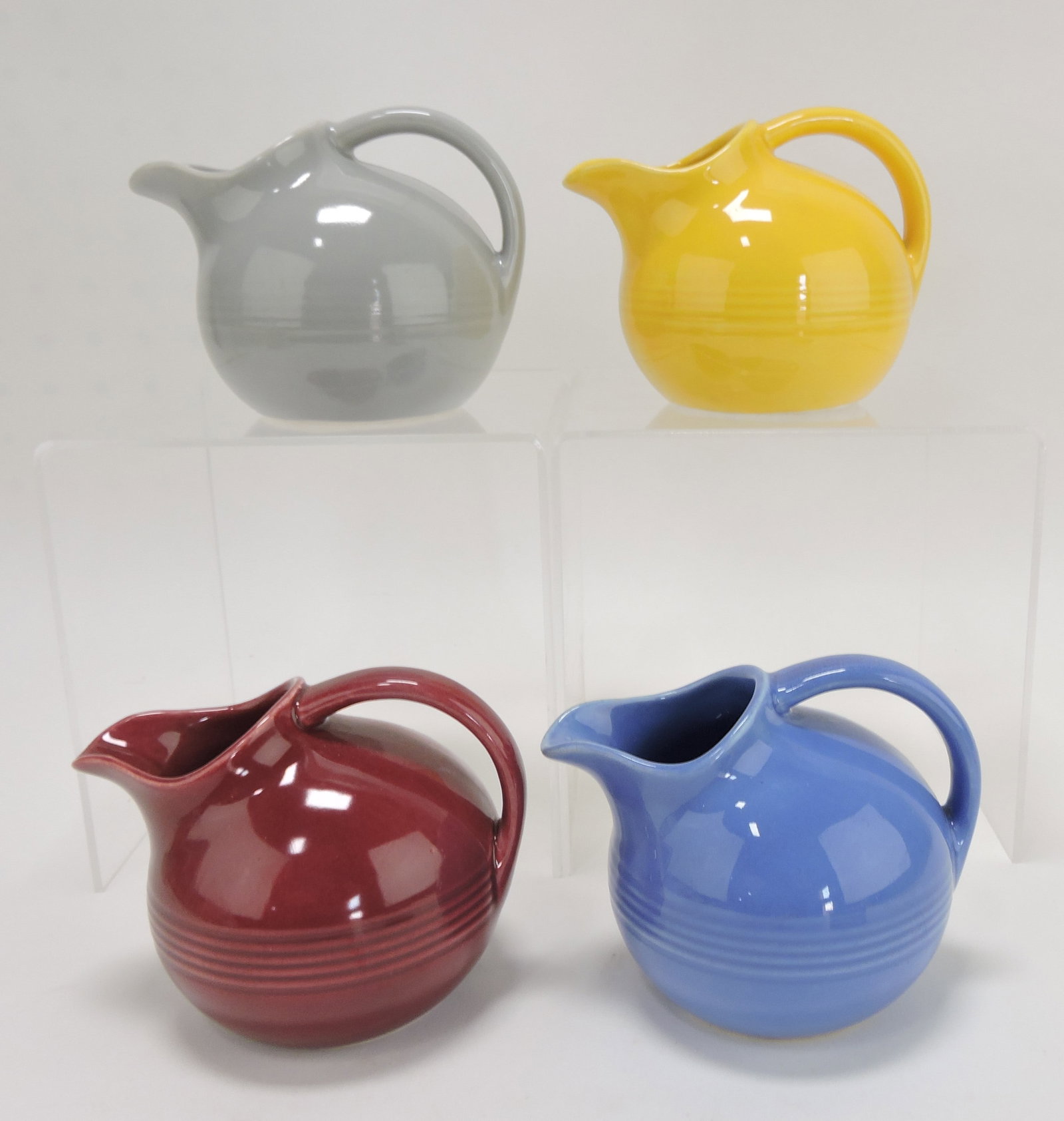 Harlequin novelty creamer group:: gray, yellow, maroon, mauve blue