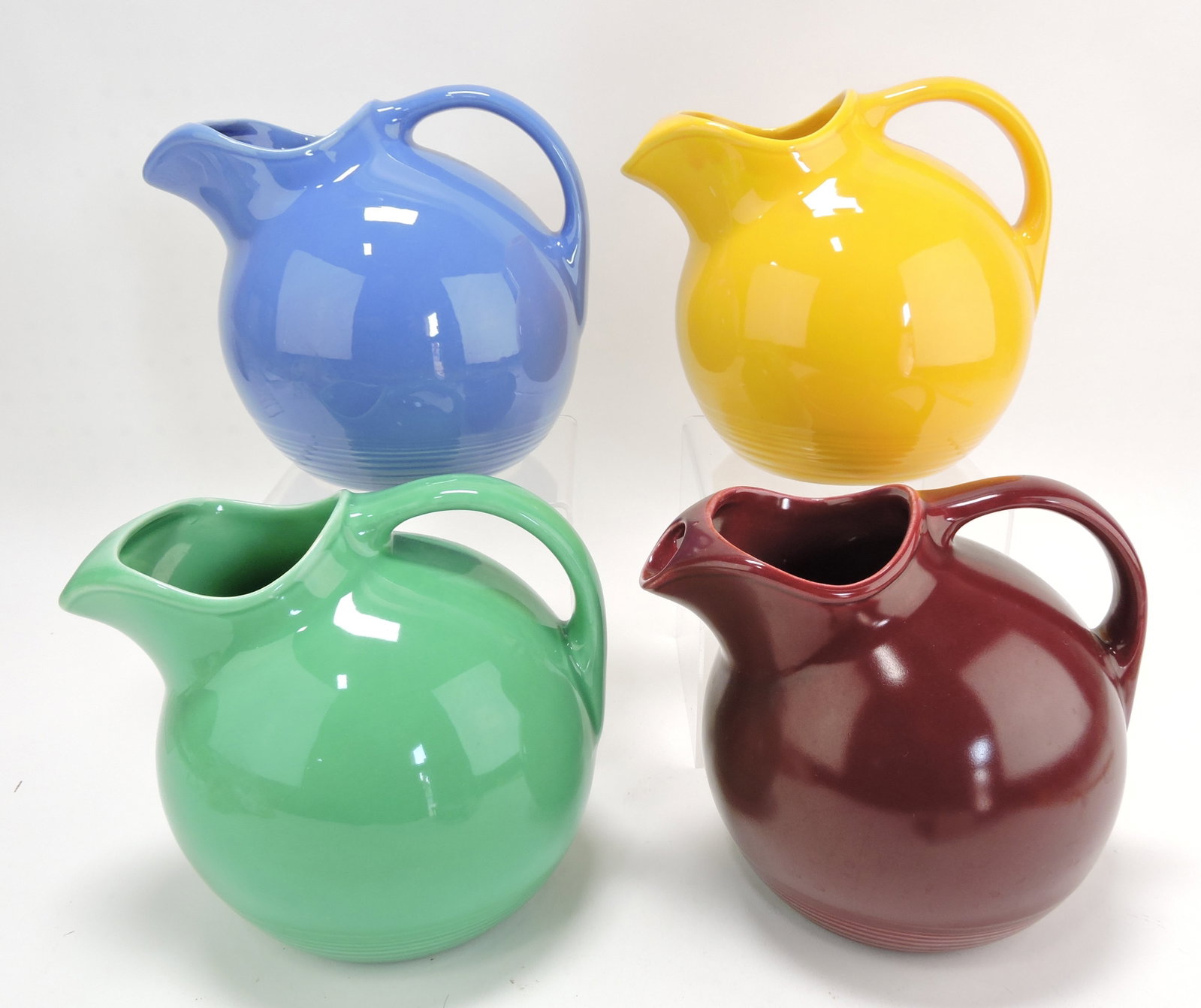 Harlequin service water jug group:: mauve blue, yellow, green, maroon