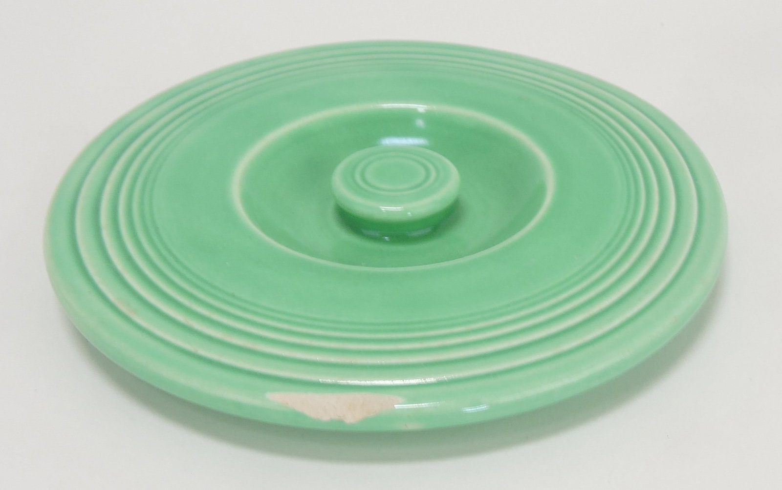 Fiesta #1 mixing bowl lid, green,: rim chip