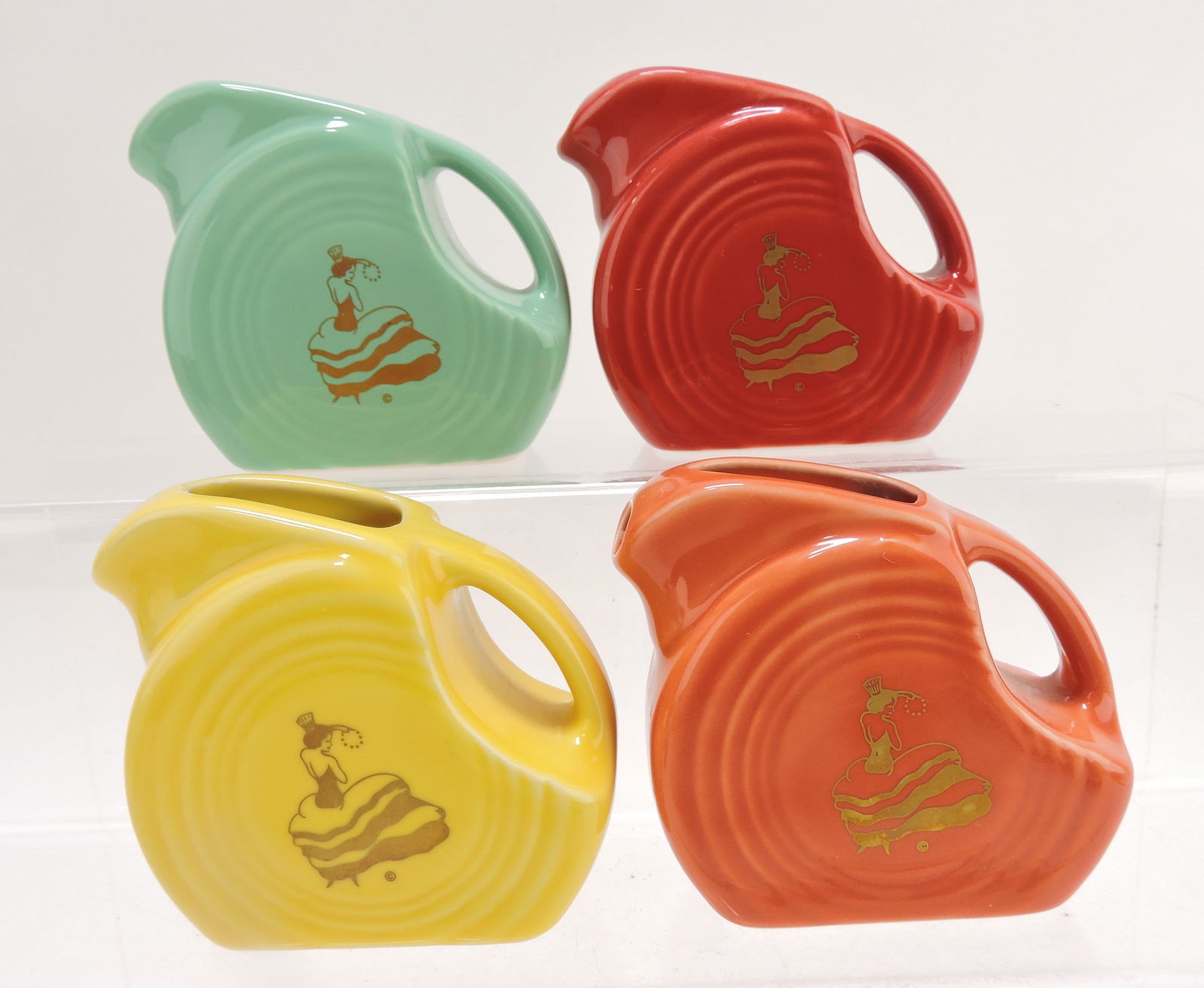 Fiesta Post 86 mini disc pitcher group,: 4 with dancing girl