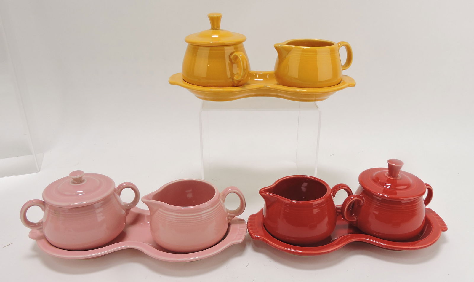 Fiesta Post 86 cream, sugar, and tray: group, marigold, rose, scarlet