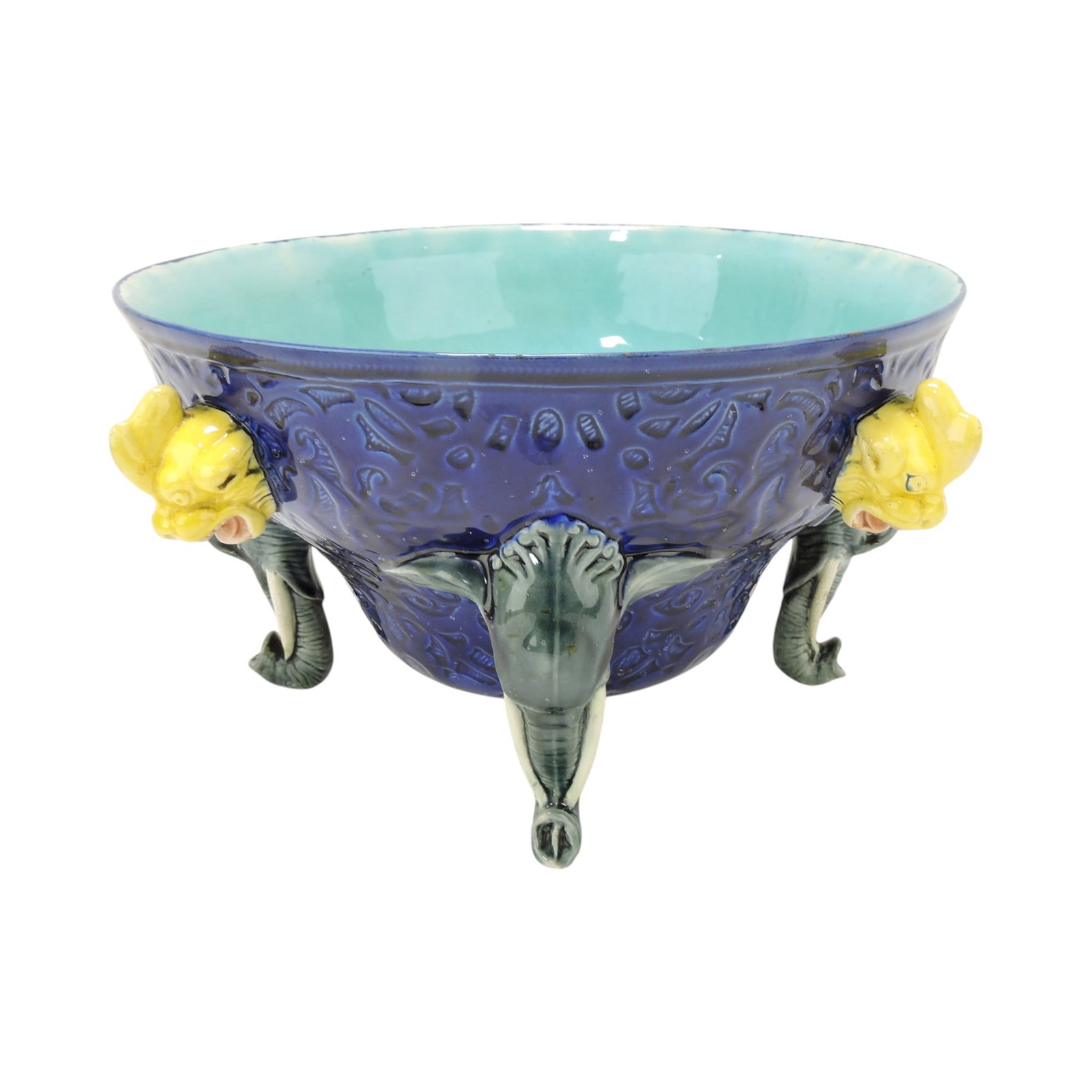 Rare Wedgwood cobalt majolica: Elephant punch bowl with bowl being supported by four elephants as feet and four grotesque mask handles, 6 1/2"h, 12"w. The Leberfeld Collection