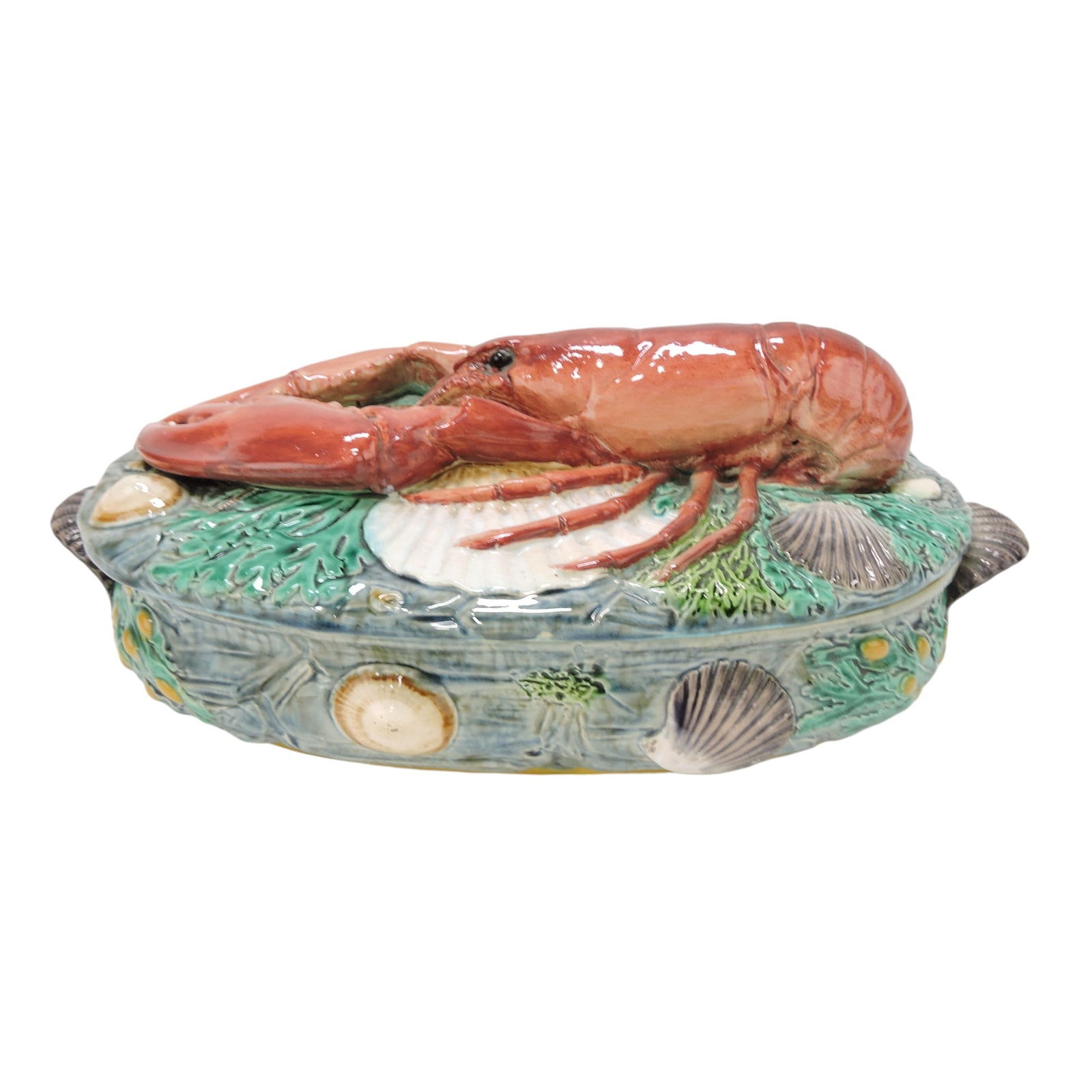 Minton majolica iconic lobster tureen: with shell handled base decorated with seaweed and shells with large lobster on cover atop a bed of shells and seaweed, shape no. 1523, 13 1/2"w. The Leberfeld Collection