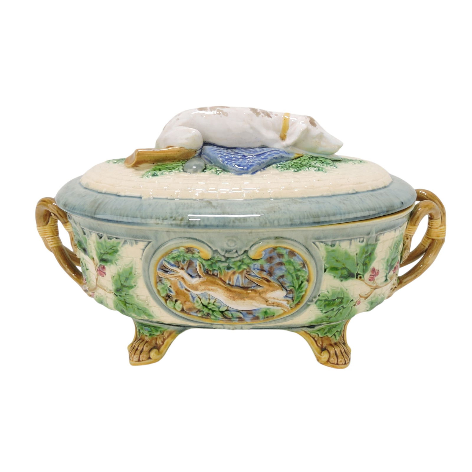 Minton majolica 'Gun Dog' game: tureen with recumbent dog and gun on cover, base with panel of rabbit on one side and pheasant on other, paw feet, vine handles. The Leberfeld Collection