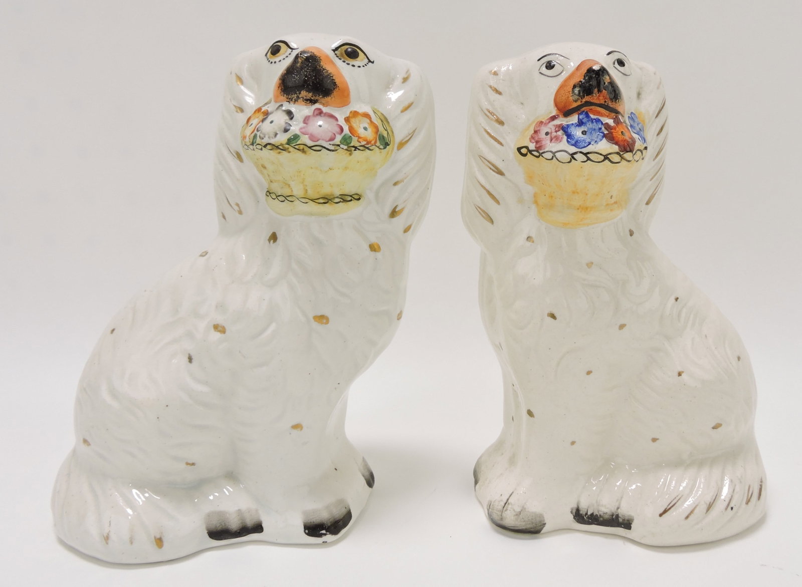 Staffordshire pair of flower basket: spaniels, 7"