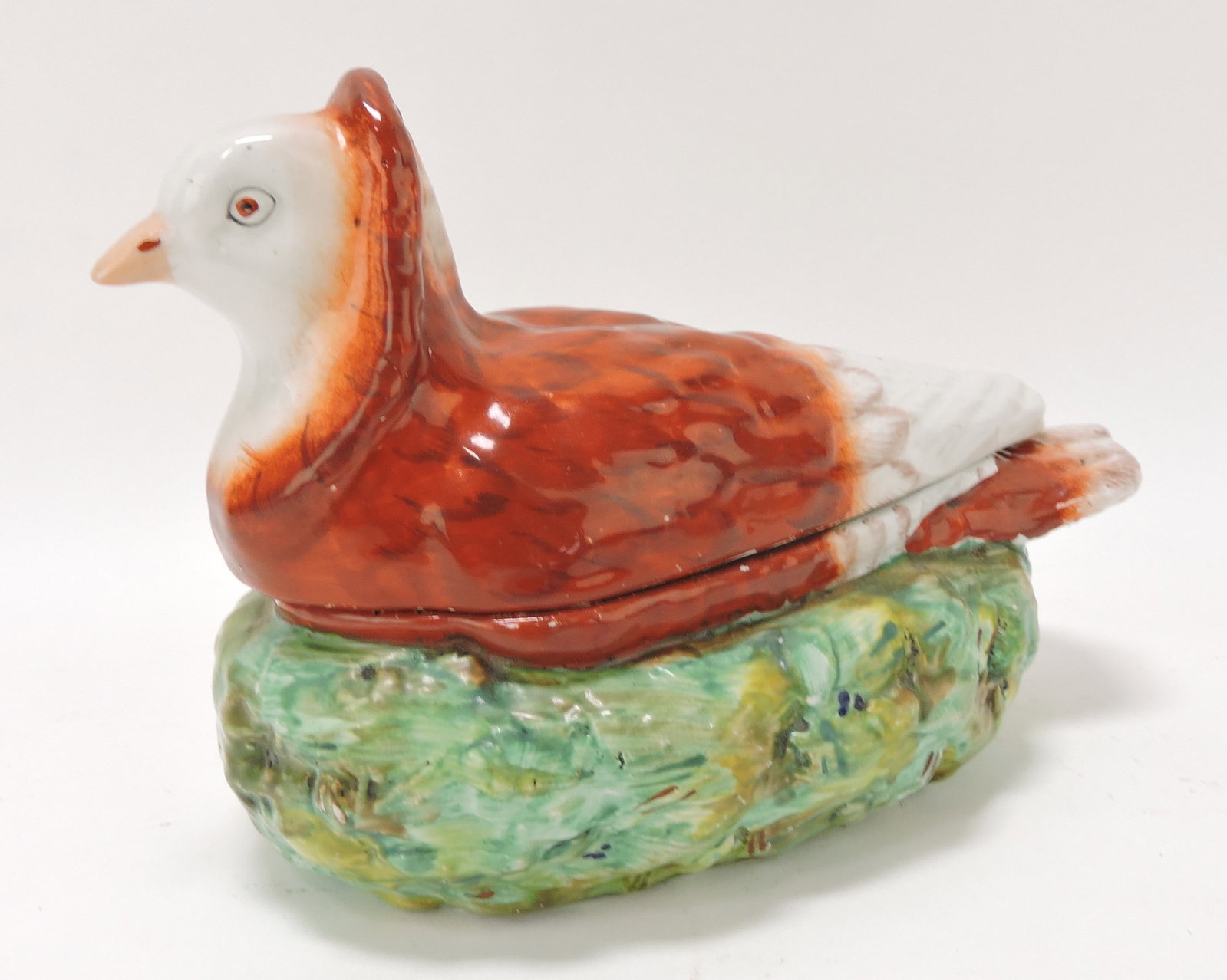 Staffordshire pigeon on nest, 6"h, 8"l: .