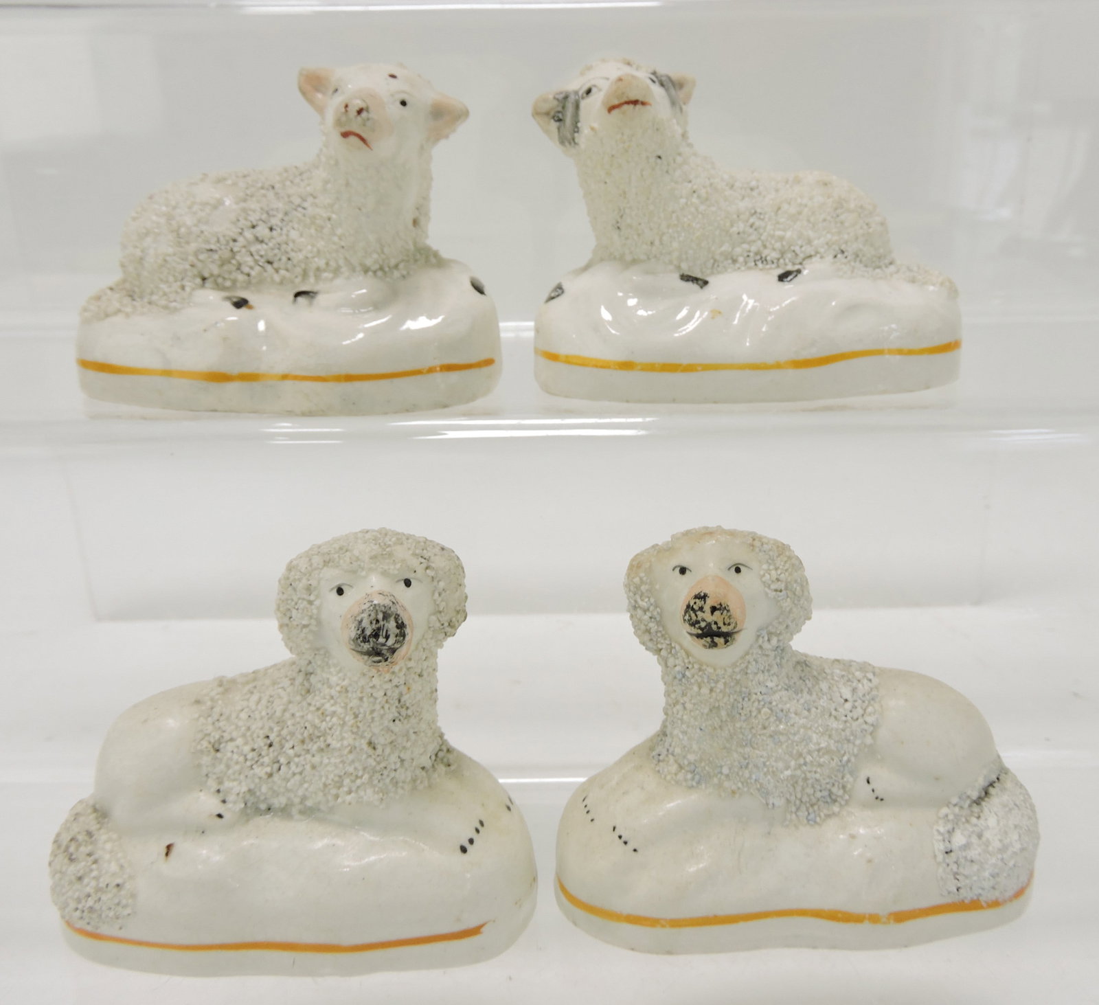 Staffordshire pair of sheep and pair: of poodles, 2 1/2"
