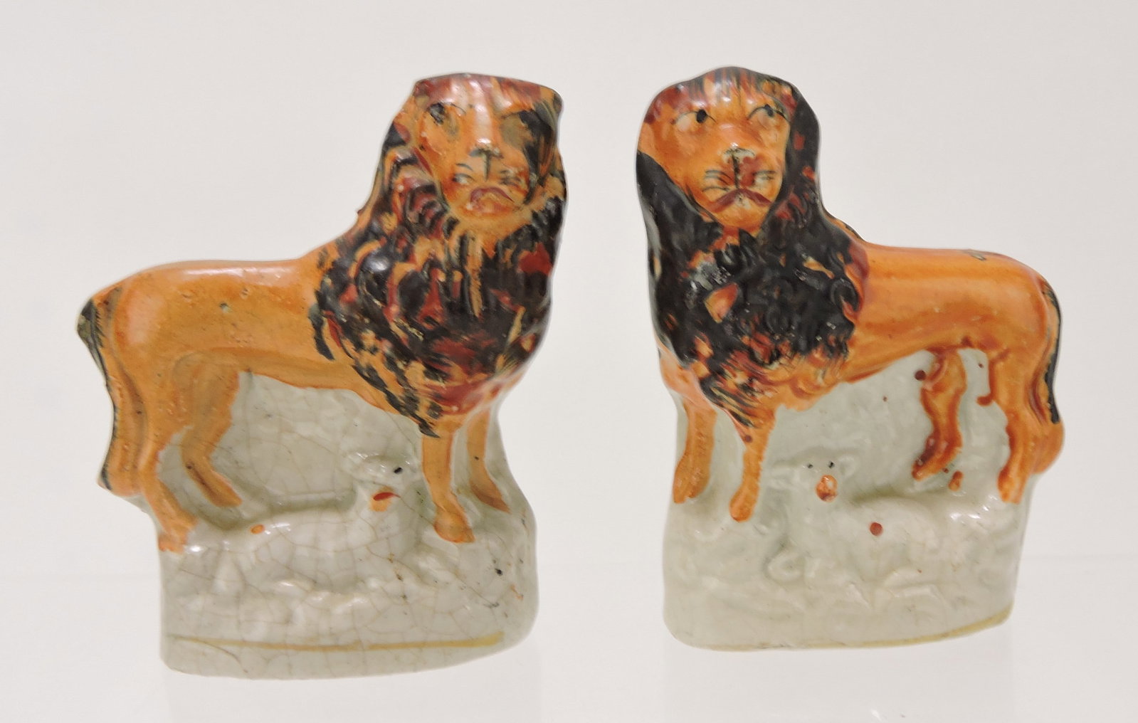 Staffordshire pair of lions, 3 1/2": .