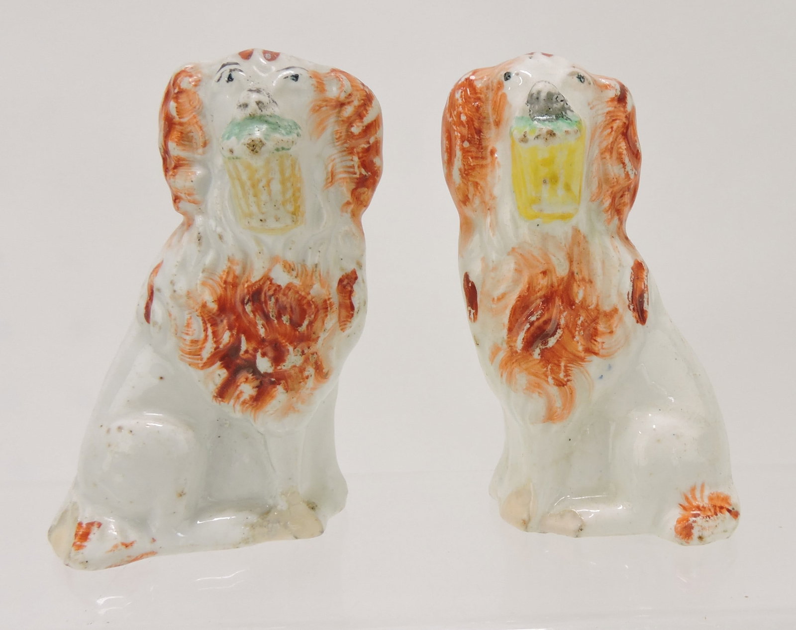 Staffordshire pair of flower basket dogs,: 3 1/2", base rim repair