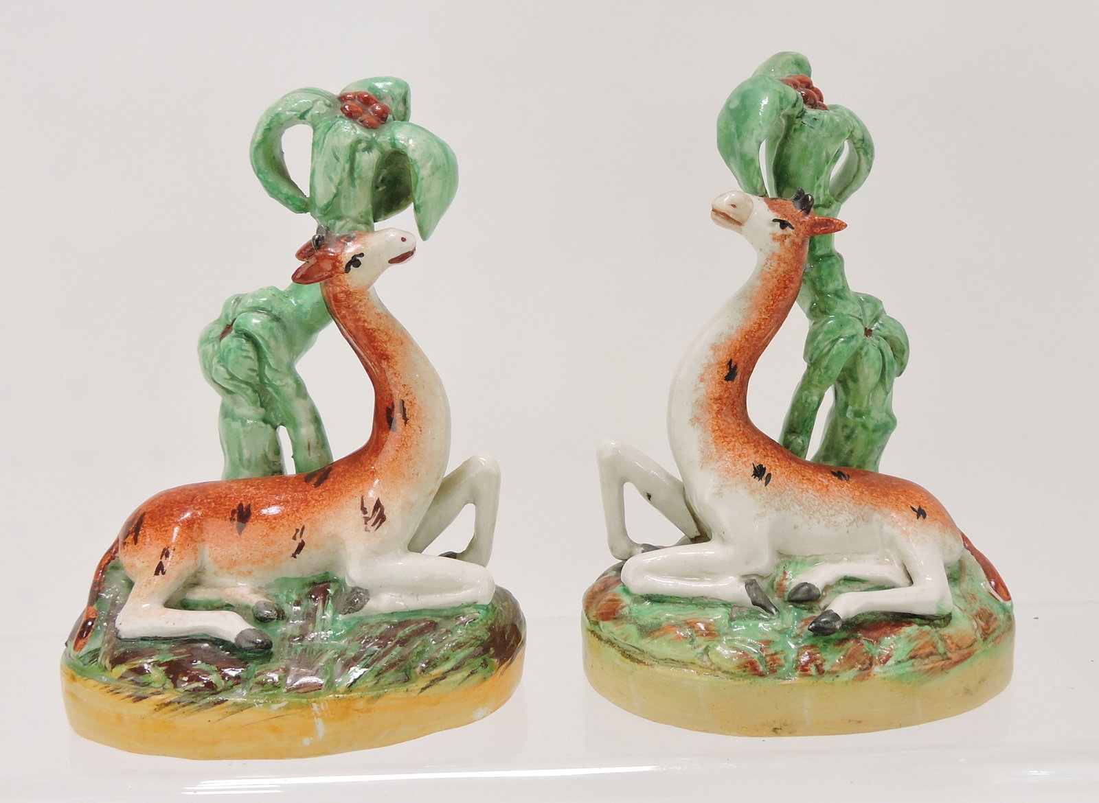 Staffordshire pair of giraffes, 5 1/2",: various condition