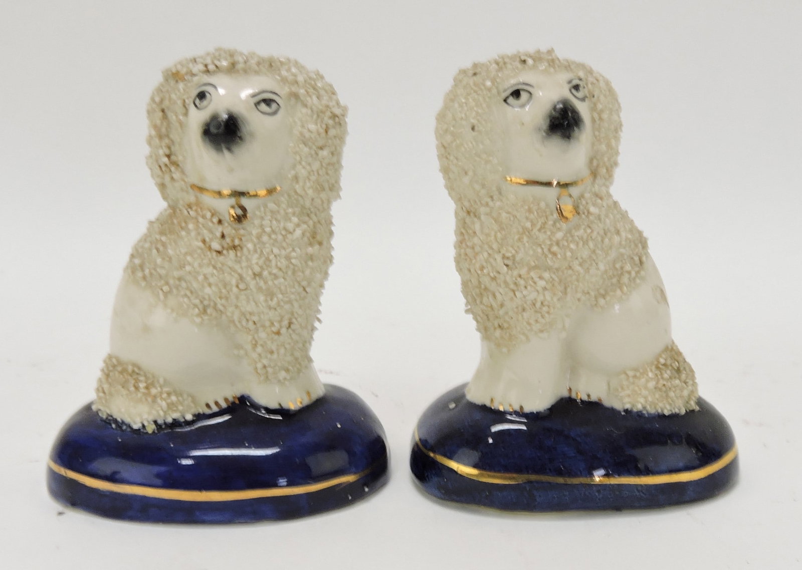 Staffordshire pair of poodles on cobalt: bases, 3 1/2"