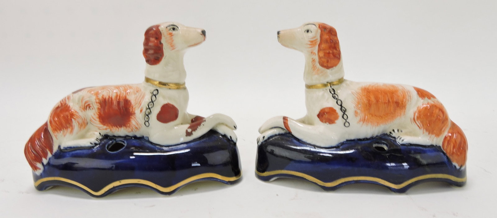 Staffordshire pair of dog pen holders,: 4"