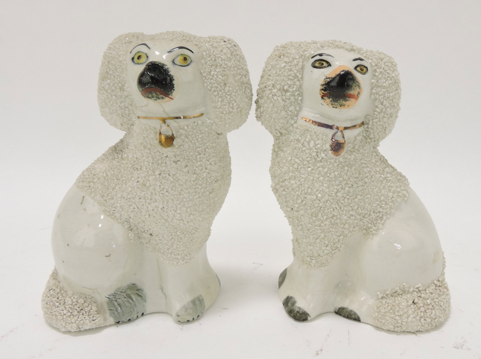 Staffordshire pair of poodles, 4 3/4",: hairline to left dog