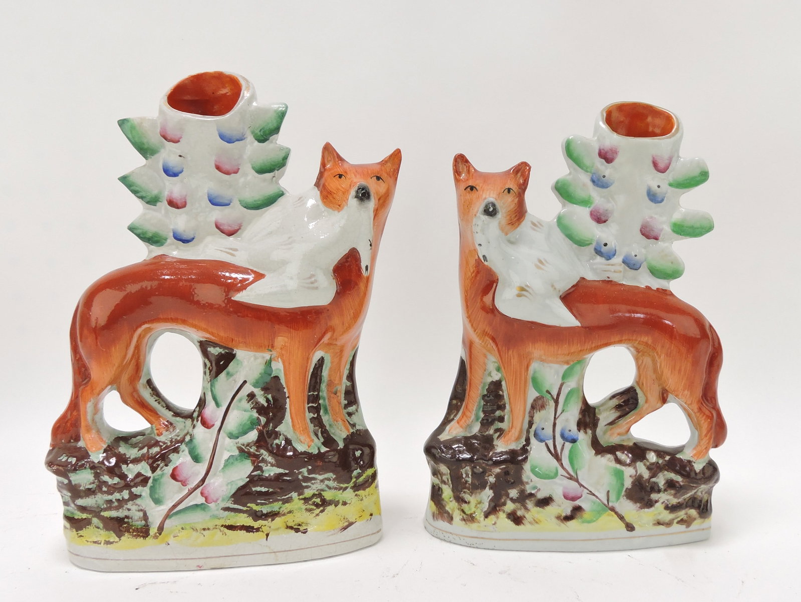 Staffordshire pair of fox spill vases,: 9"