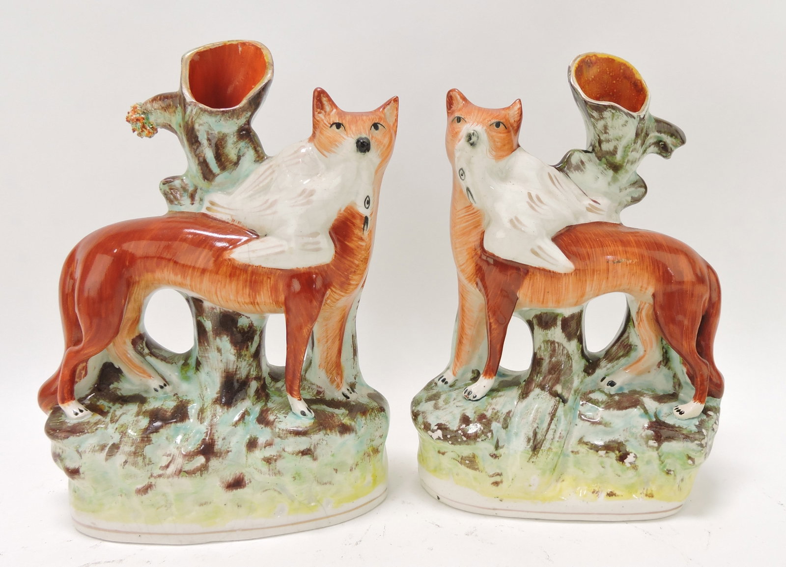 Staffordshire pair of fox spill vases,: 9"
