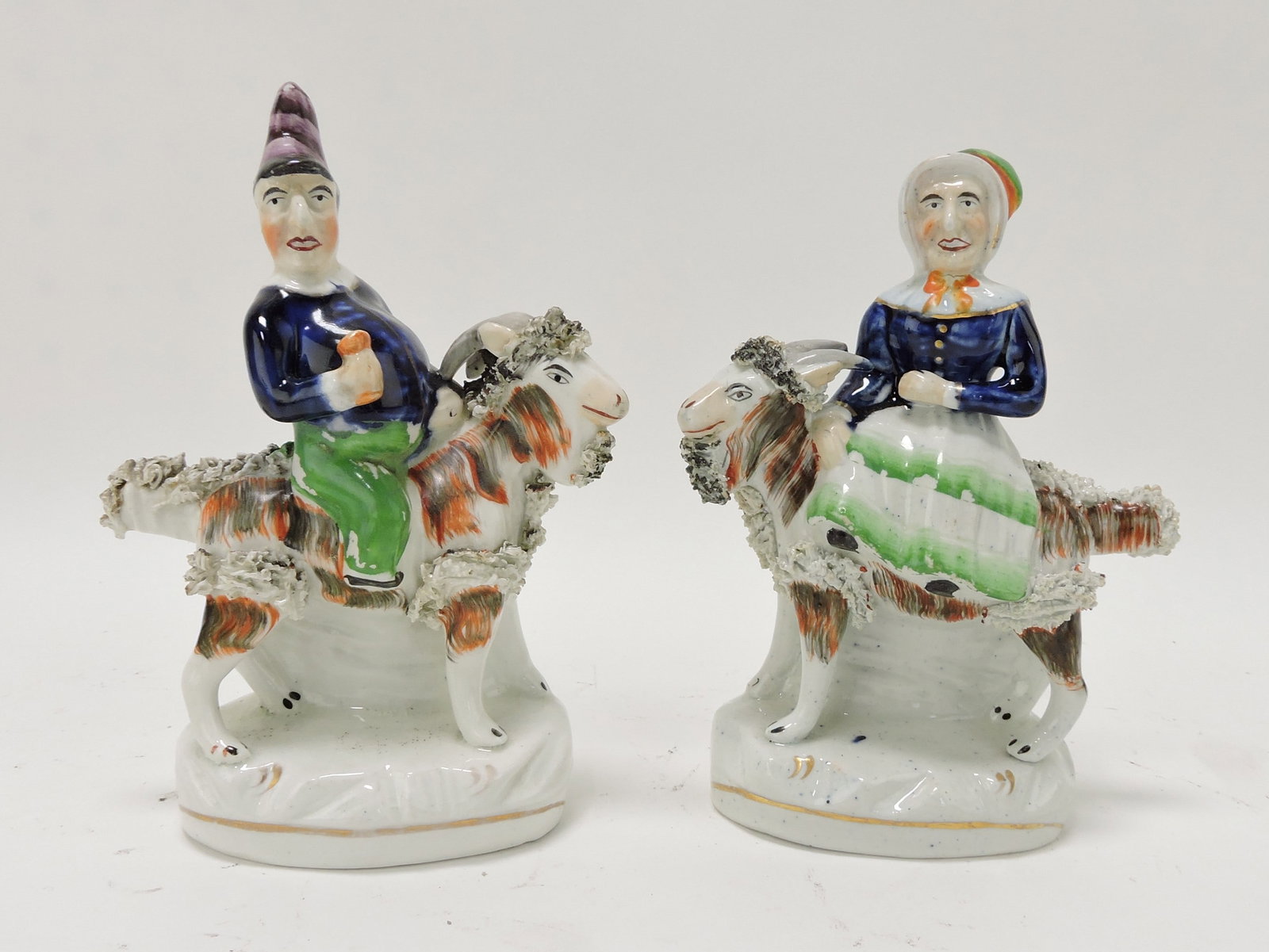 Staffordshire pair of figures, Mr. and: Mrs. Punch, 7"