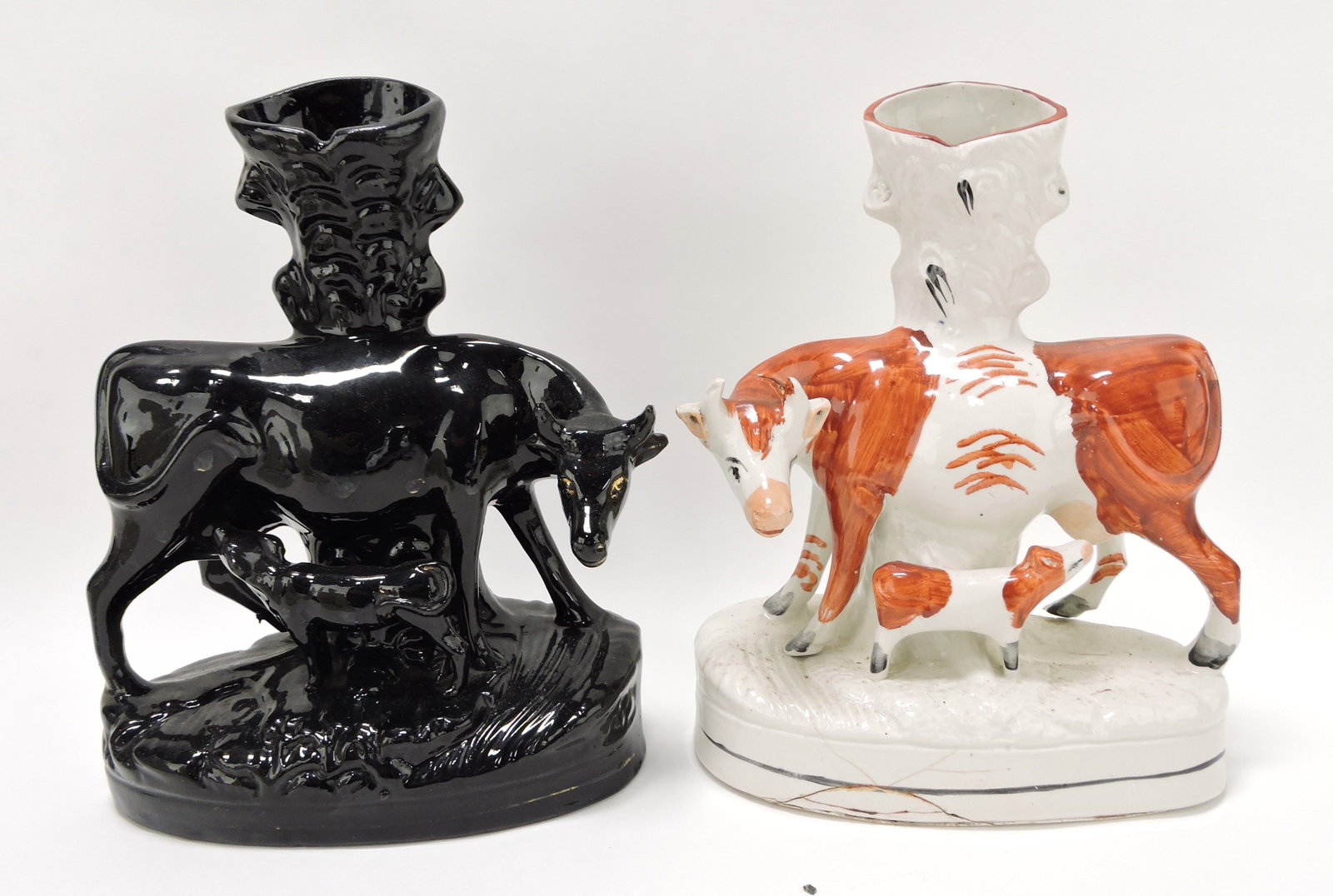 Staffordshire lot of 2 cow spill vases,: 10"