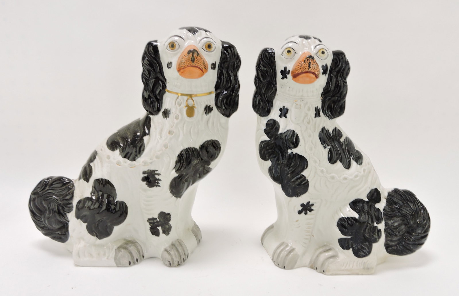 Staffordshire pair of #1 black and: white spaniels, 12"