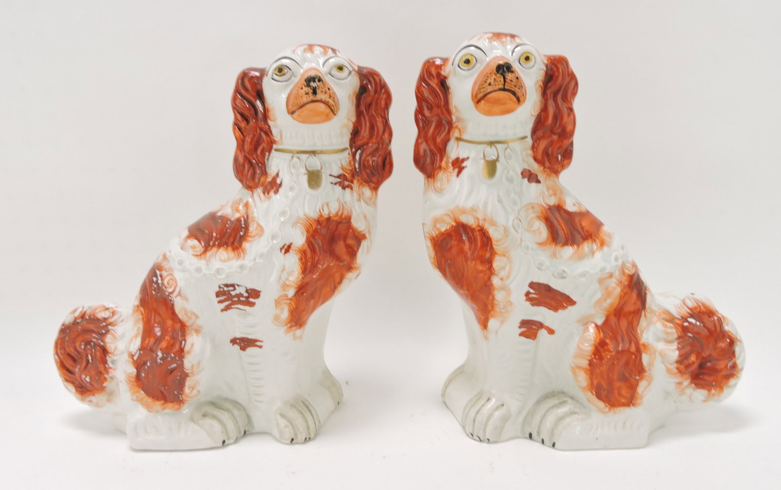 Staffordshire pair of #1 russet spaniels,: 12"