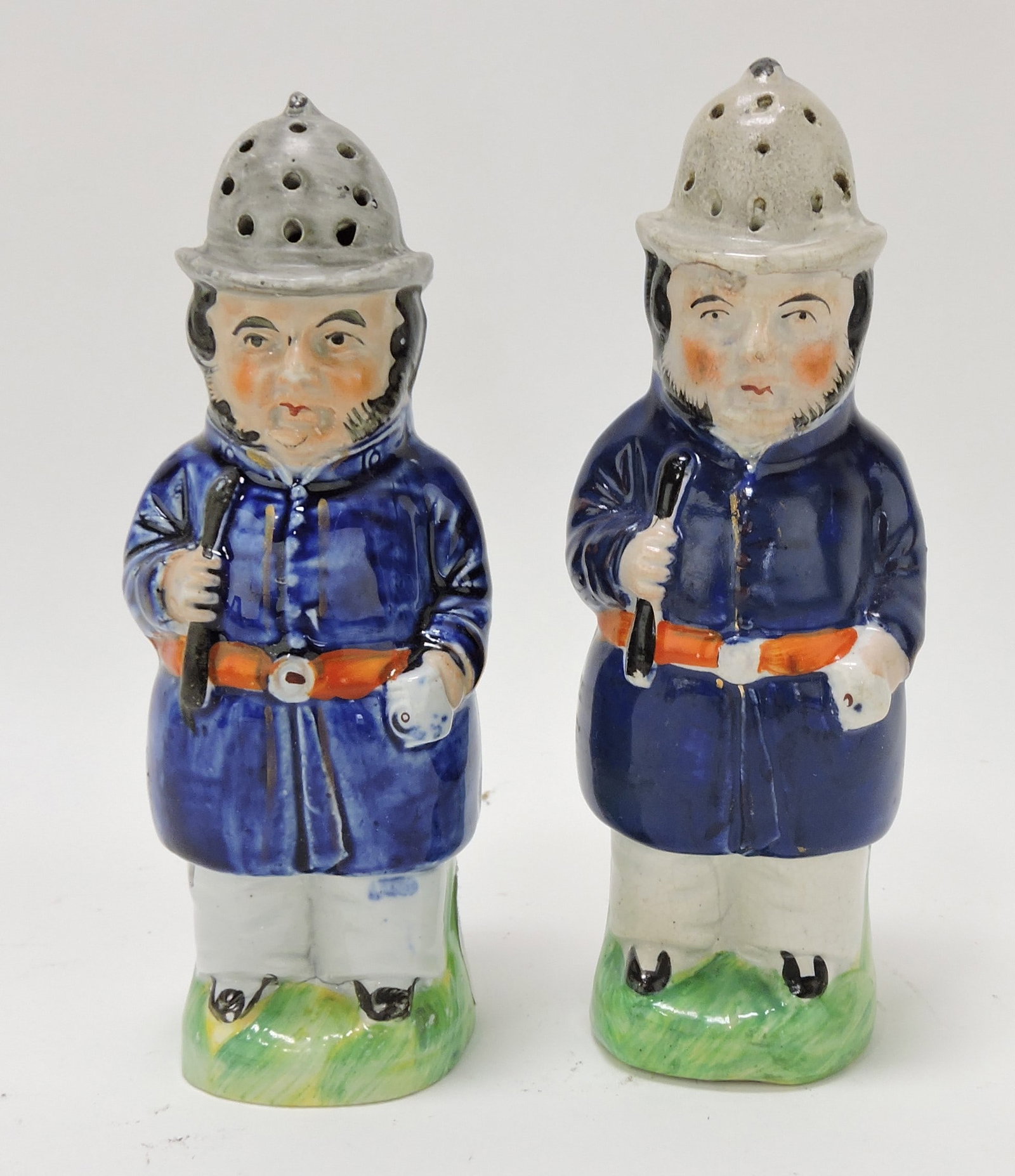 Staffordshire pair of policeman shakers,: 6 1/2"