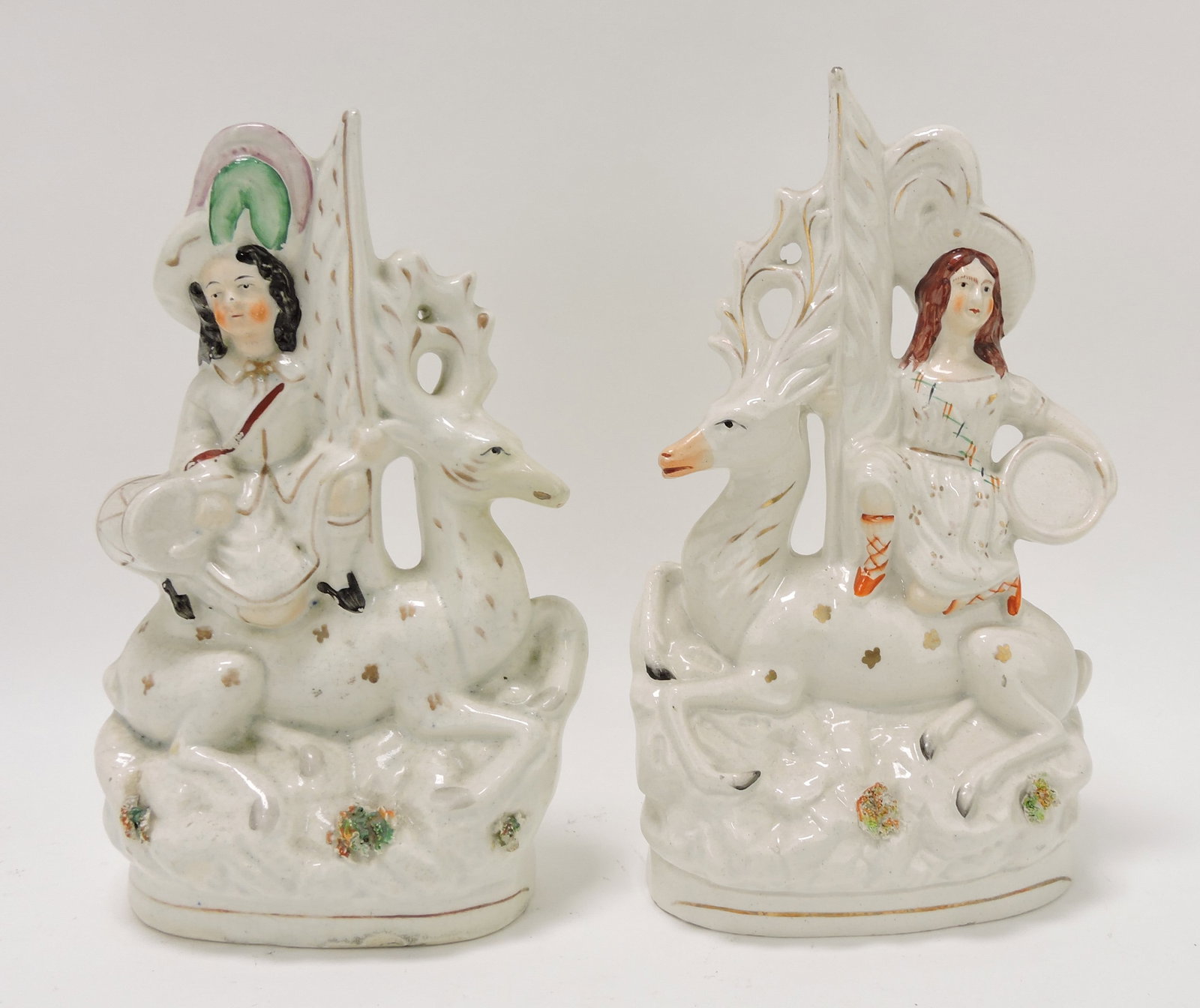 Staffordshire pair of figures with deer: and Royal children, repair to nose of deer of one, 11"