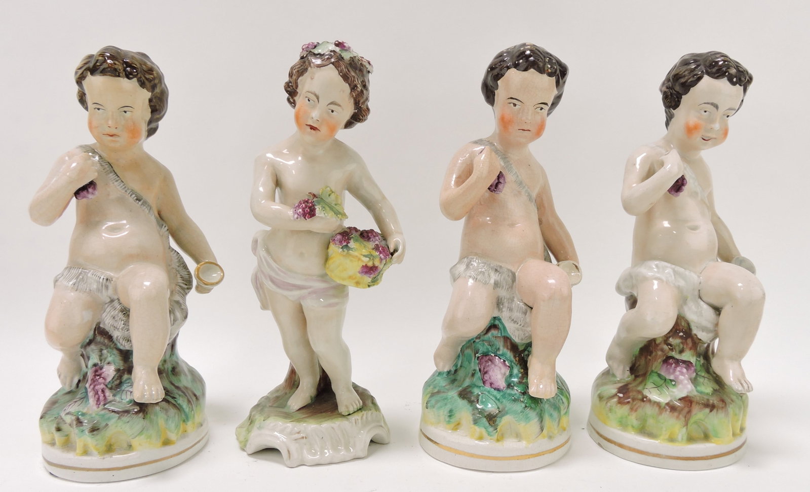 Staffordshire lot of 4 - 9" cherub: figures, various condition
