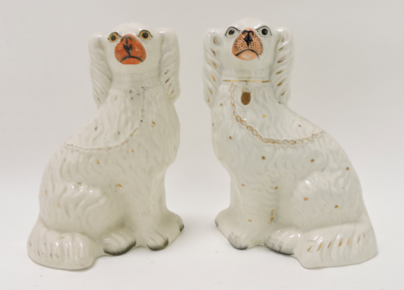 Staffordshire pair of spaniels, 10",: hairline to right dog