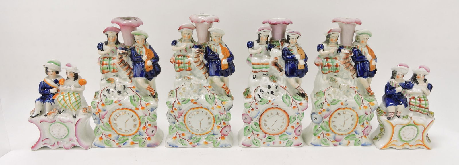 Staffordshire lot of 4 candle sticks of (1 of 1)