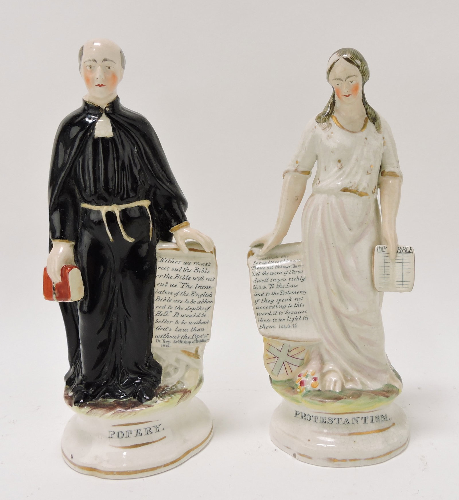 Staffordshire pair of figures 'Popery': and 'Protestantism', 9"