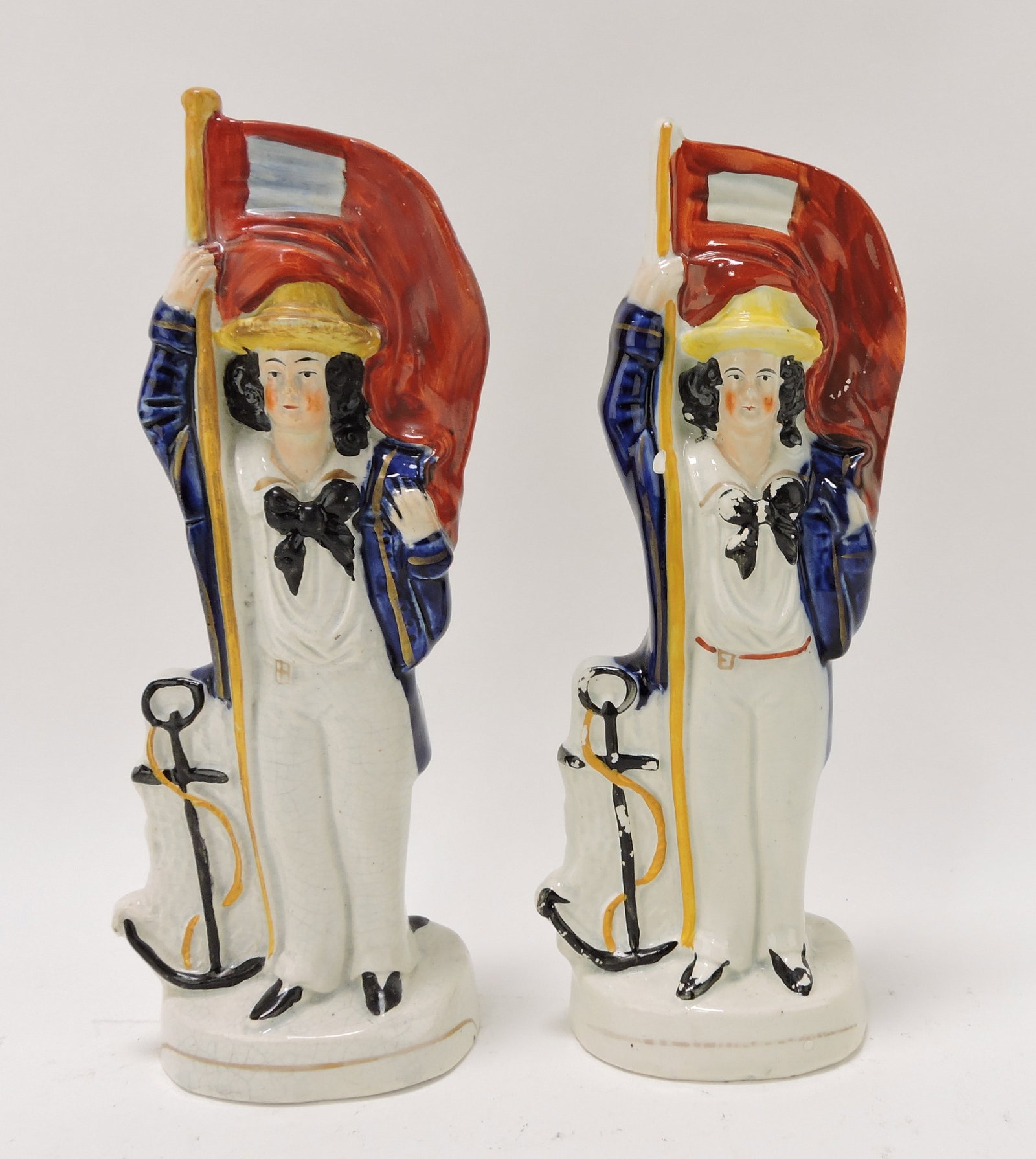 Staffordshire pair of reversible figures,: 10", sailor on one side with anchor and soldier on the other side with canon balls