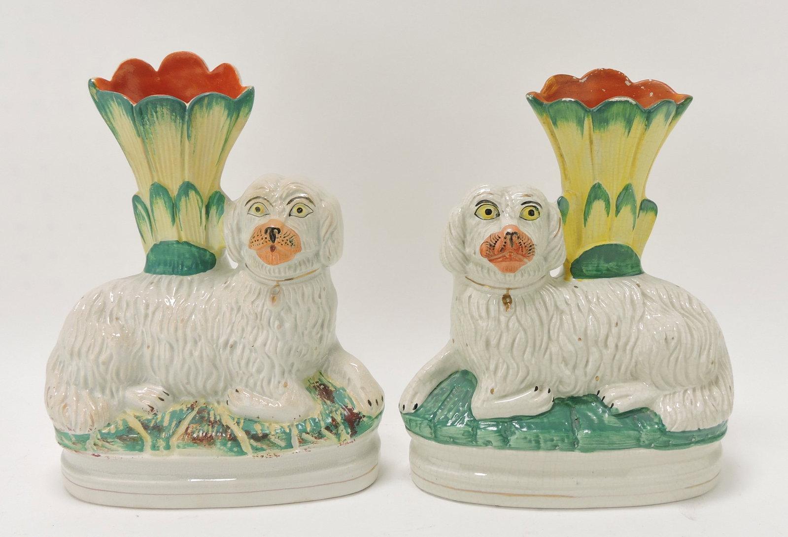 Staffordshire pair of dog spill vases,: 10"