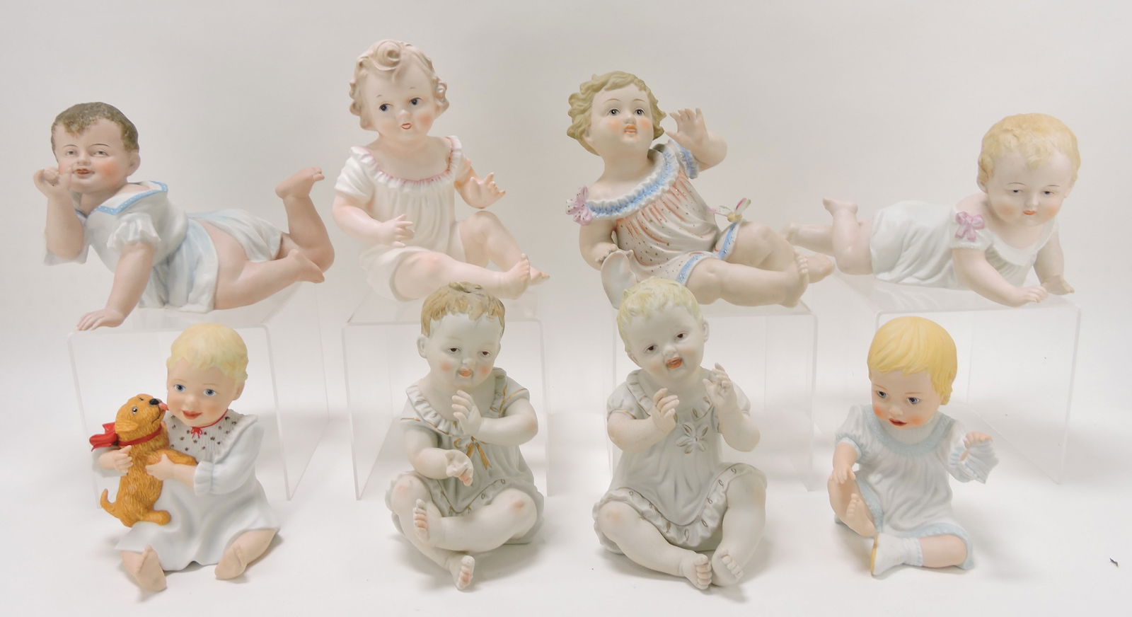 Lot of 8 bisque piano baby figures,: 6"h to 8 1/2"h