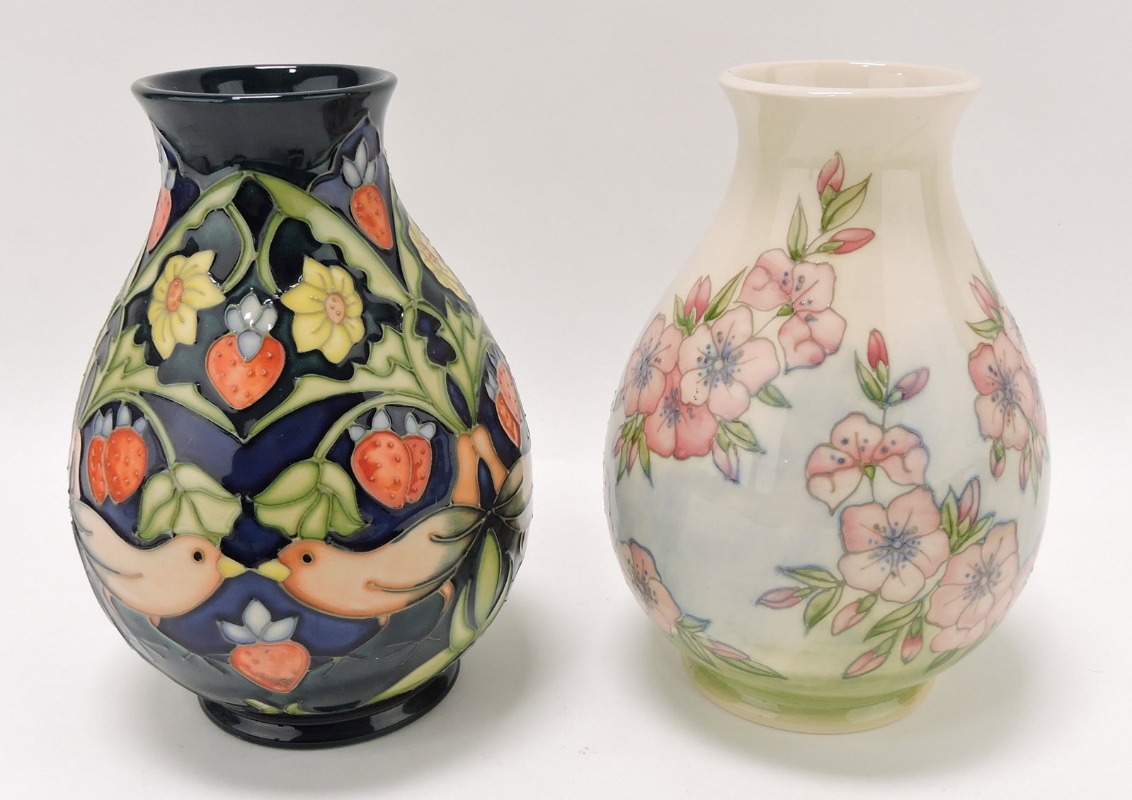 Moorcroft lot of 2 - 7" vases: .