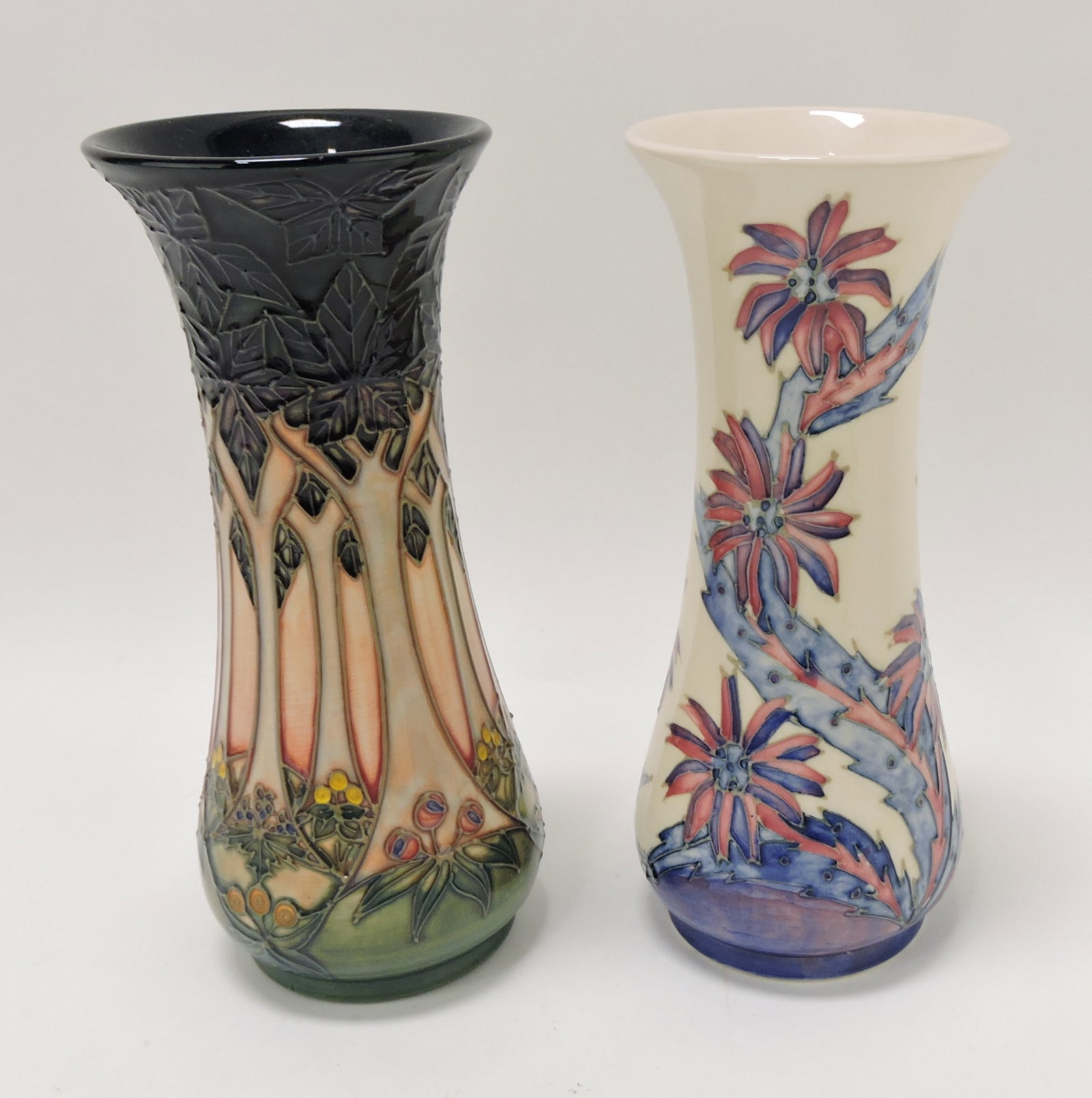 Moorcroft lot of 2 - 8" vases: .