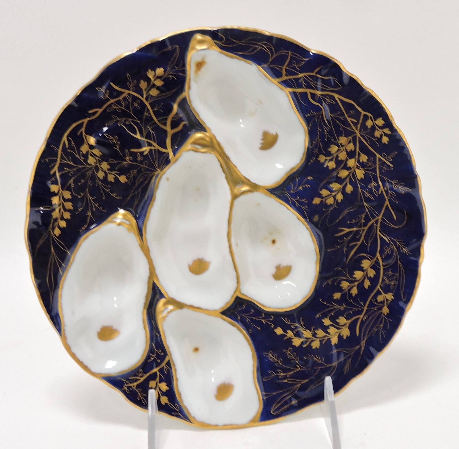 Porcelain five well 'turkey' style oyster: plate with cobalt ground and heavy gold, 8 1/2"